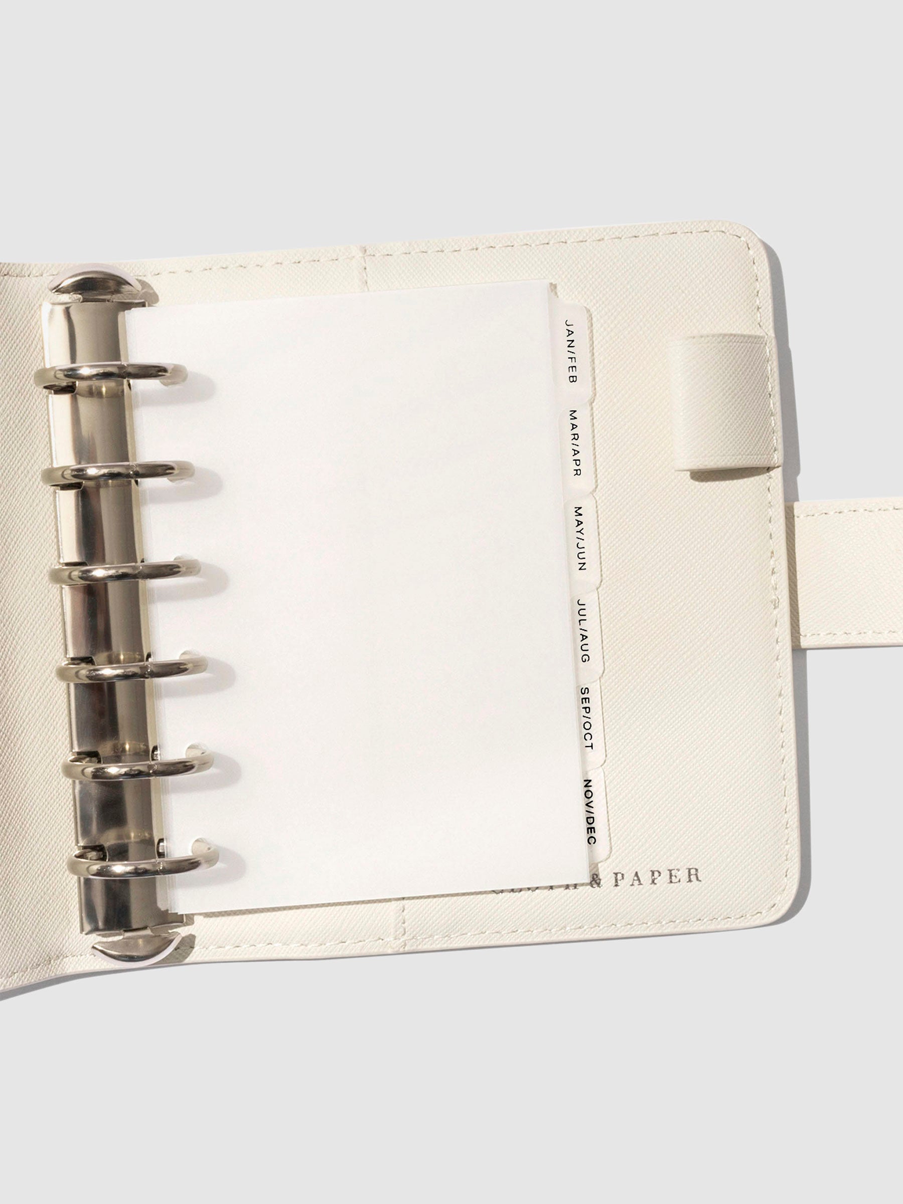 Black foil tabs displayed in use inside a leather folio.