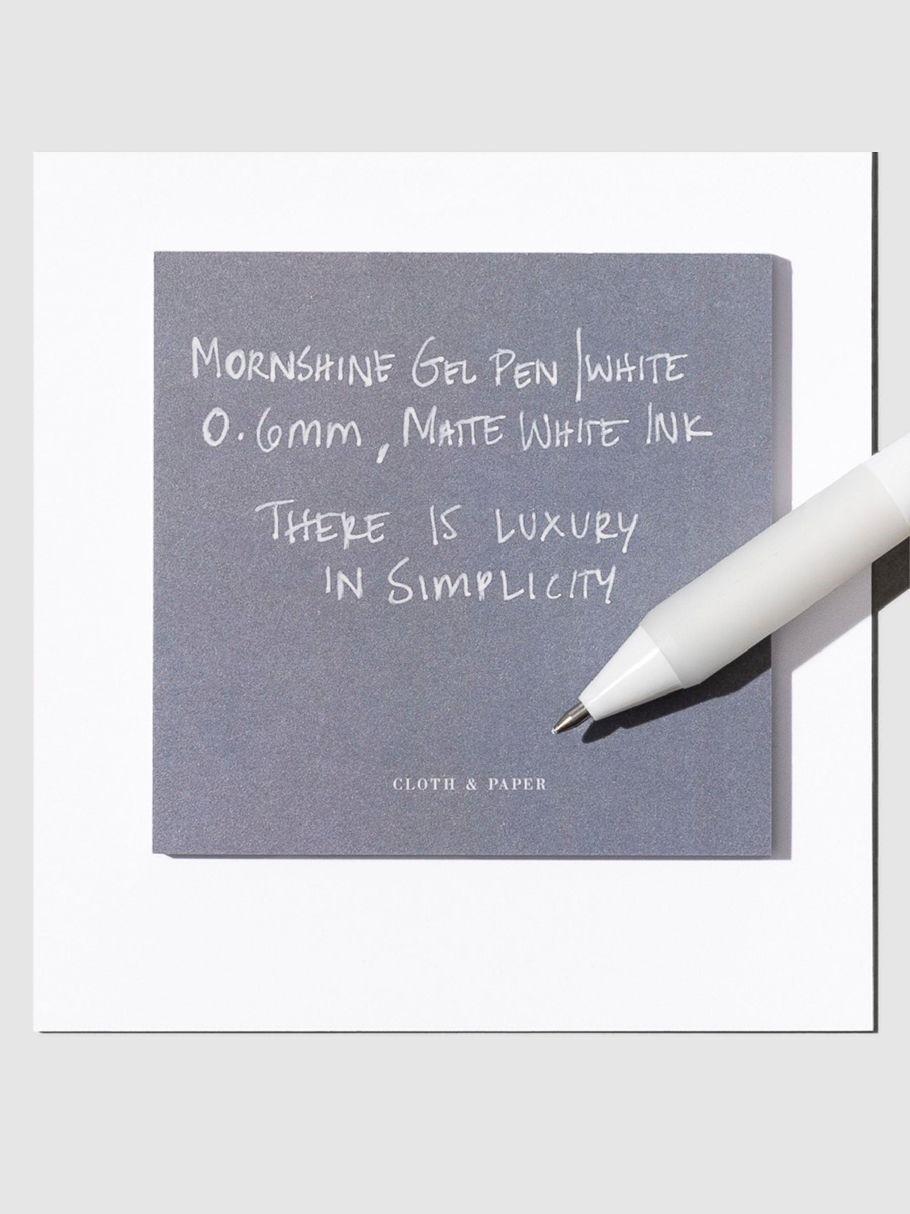 Mornshine Gel Pen, White, Cloth and Paper. Pen displayed on a neutral background.