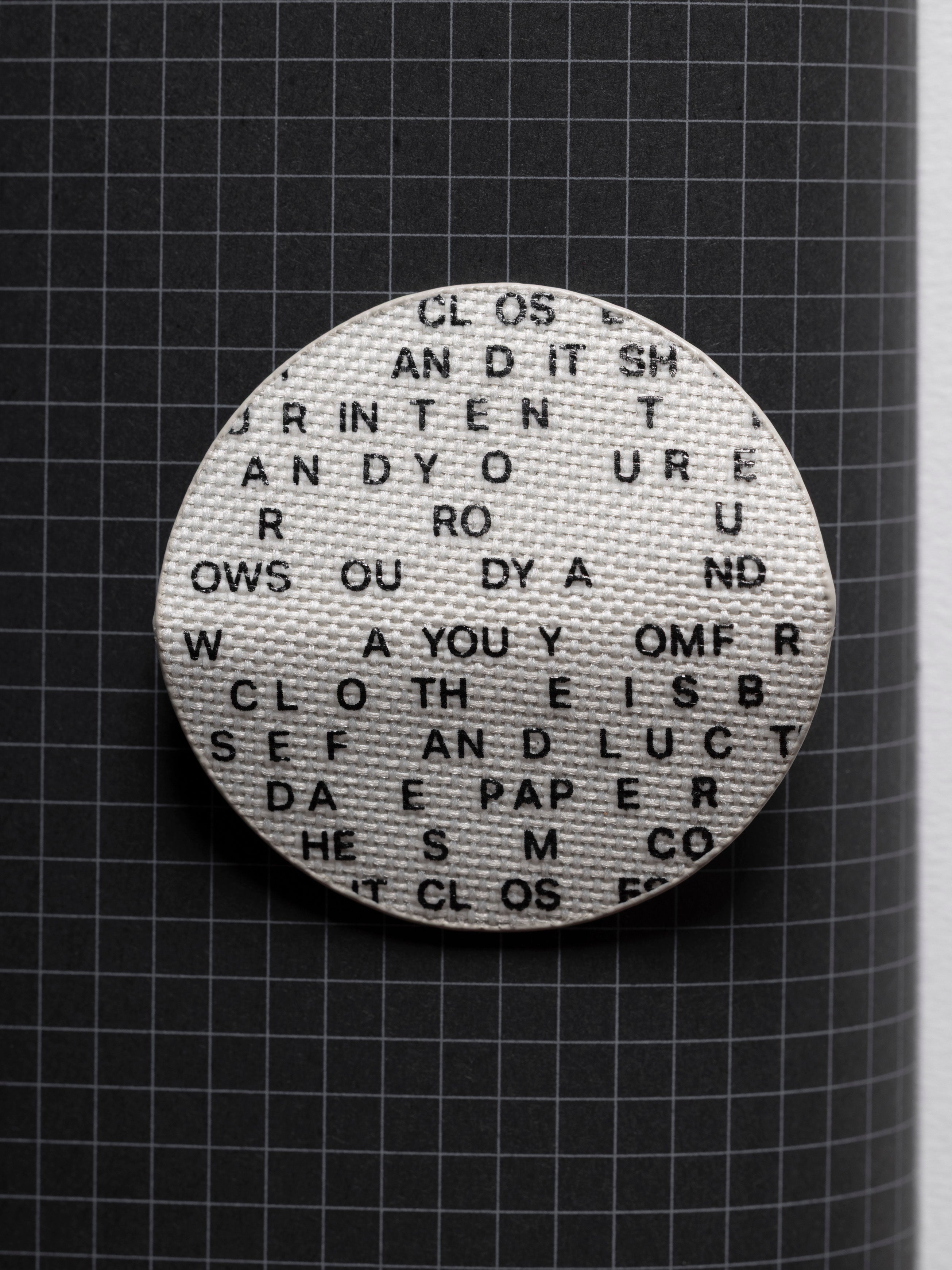 Magnetic Bookmark | Bookcloth | Letters unfolded displaying the bookcloth material and type design.