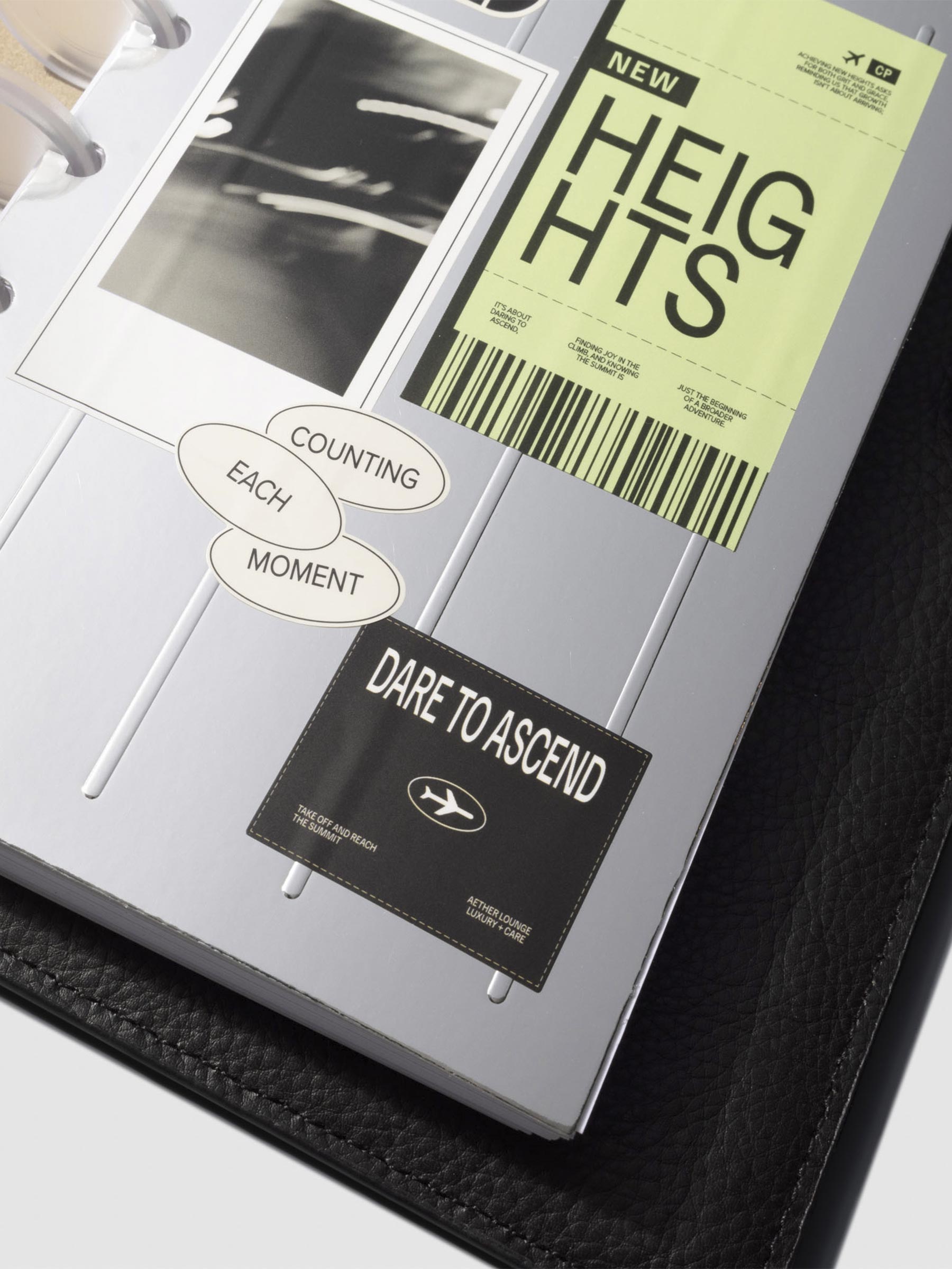 Closeup of dashboard in a black leather planner displayed on a neutral background. Size shown is HP Mini.