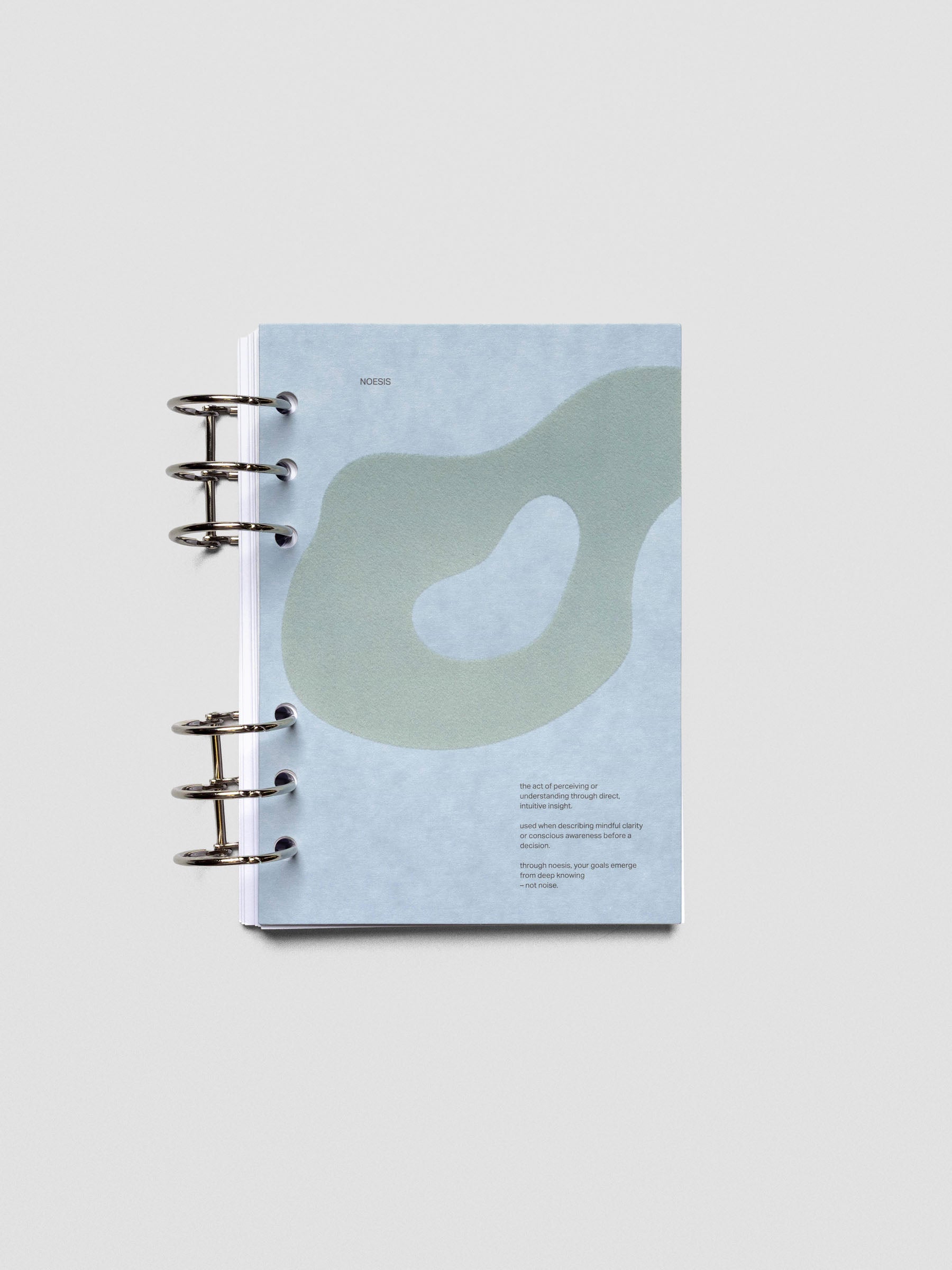 Blue speckle cardstock planner dashboard with organic shape design flocked in blue-green with text design shown in Personal Wide size ring bound.