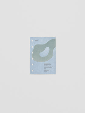 Blue speckle cardstock planner dashboard with organic shape design flocked in blue-green with text design shown in pocket size.