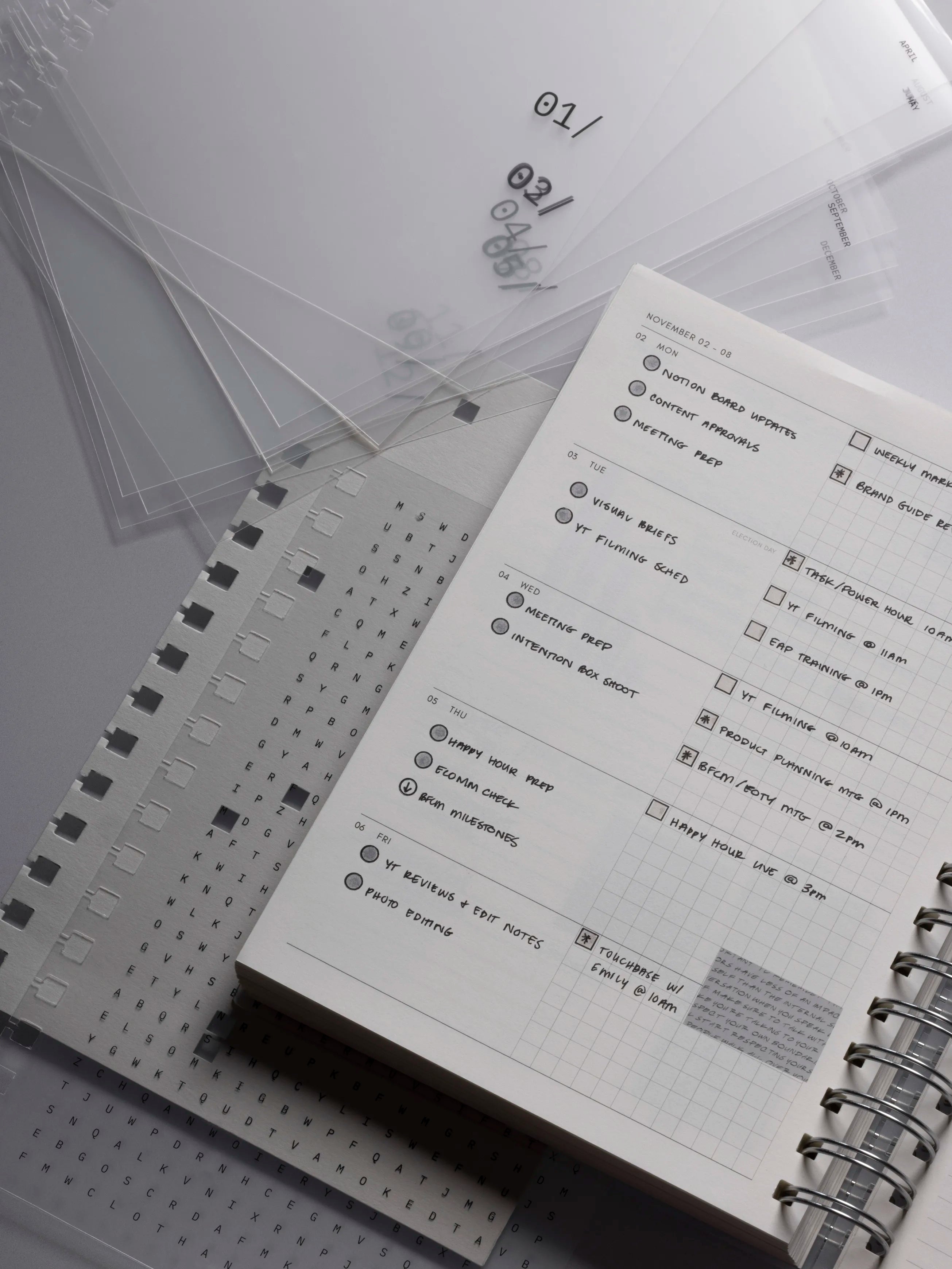 Opened 2026 Spiral Notebook with lined pages on a light gray background.