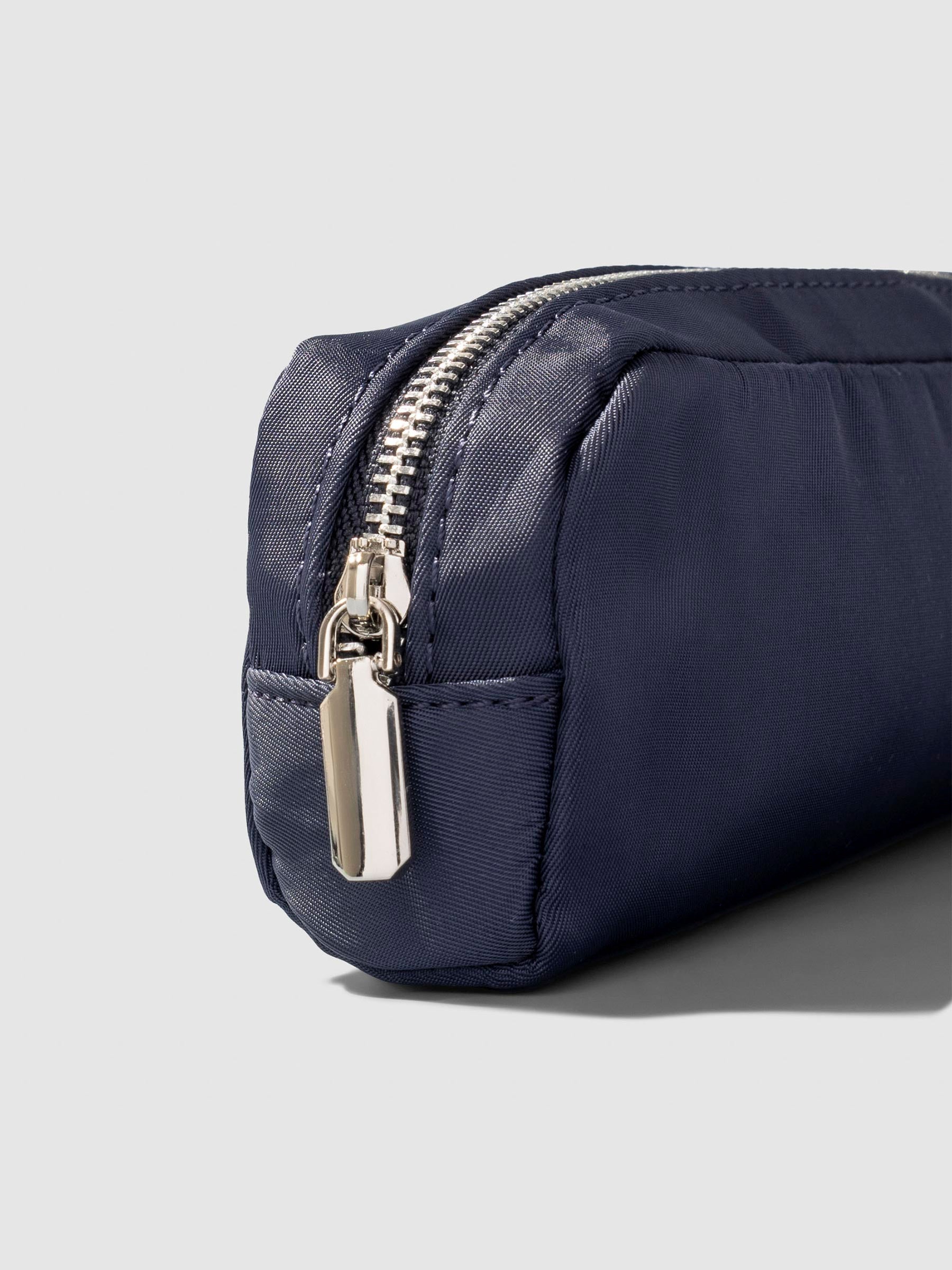 Closeup of pencil pouch's zipper. Color featured is Apollo.