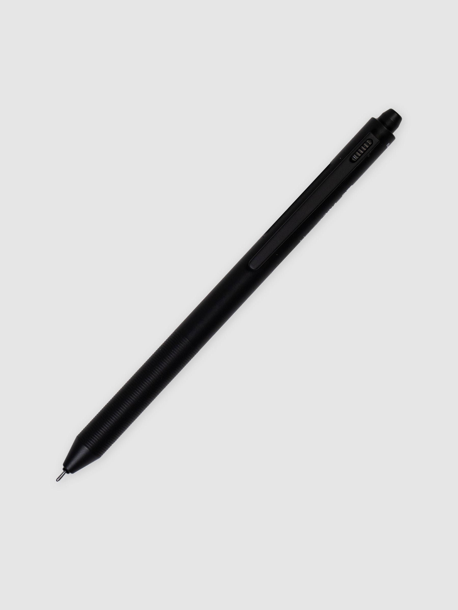 Ohto Blooom 3 in 1 Multi Pen, Cloth and Paper. Gray pen turned to the right against a neutral background.