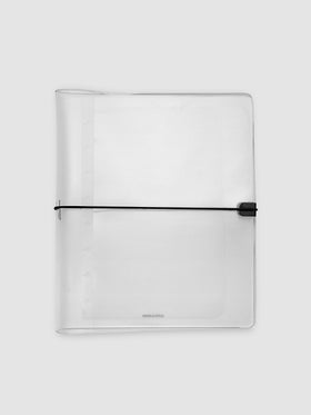 A clear plastic large notebook cover with a black elastic closure band, closed, against a light gray background.