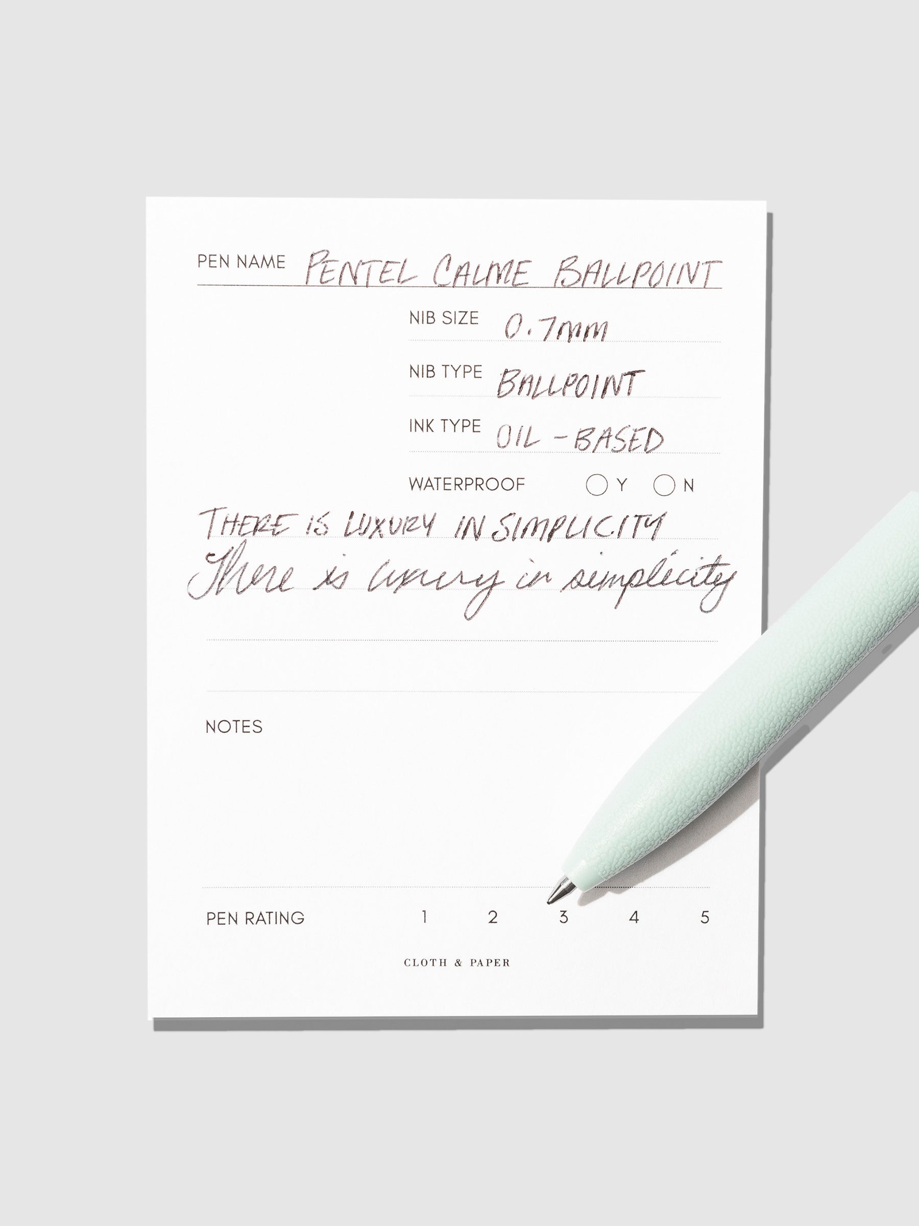 Pen displayed on an in use pen test sheet. The pen's barrel color is Sky Jade.