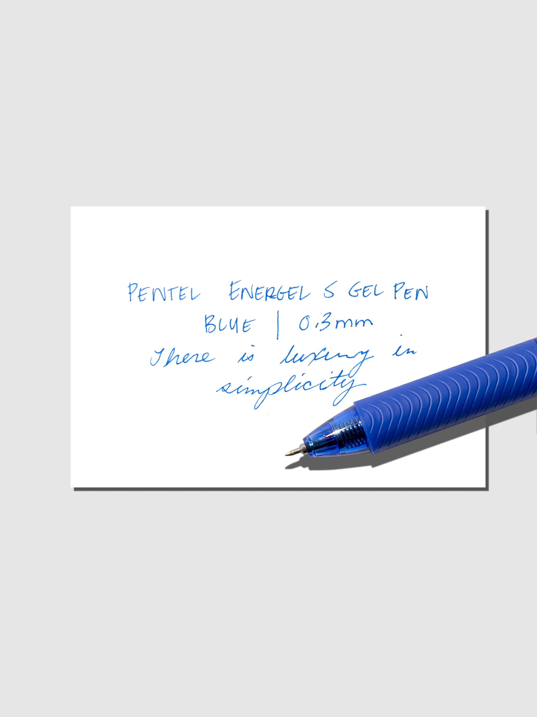 Writing sample with a Pentel EnergelS Gelpen displayed on a neutral background.
