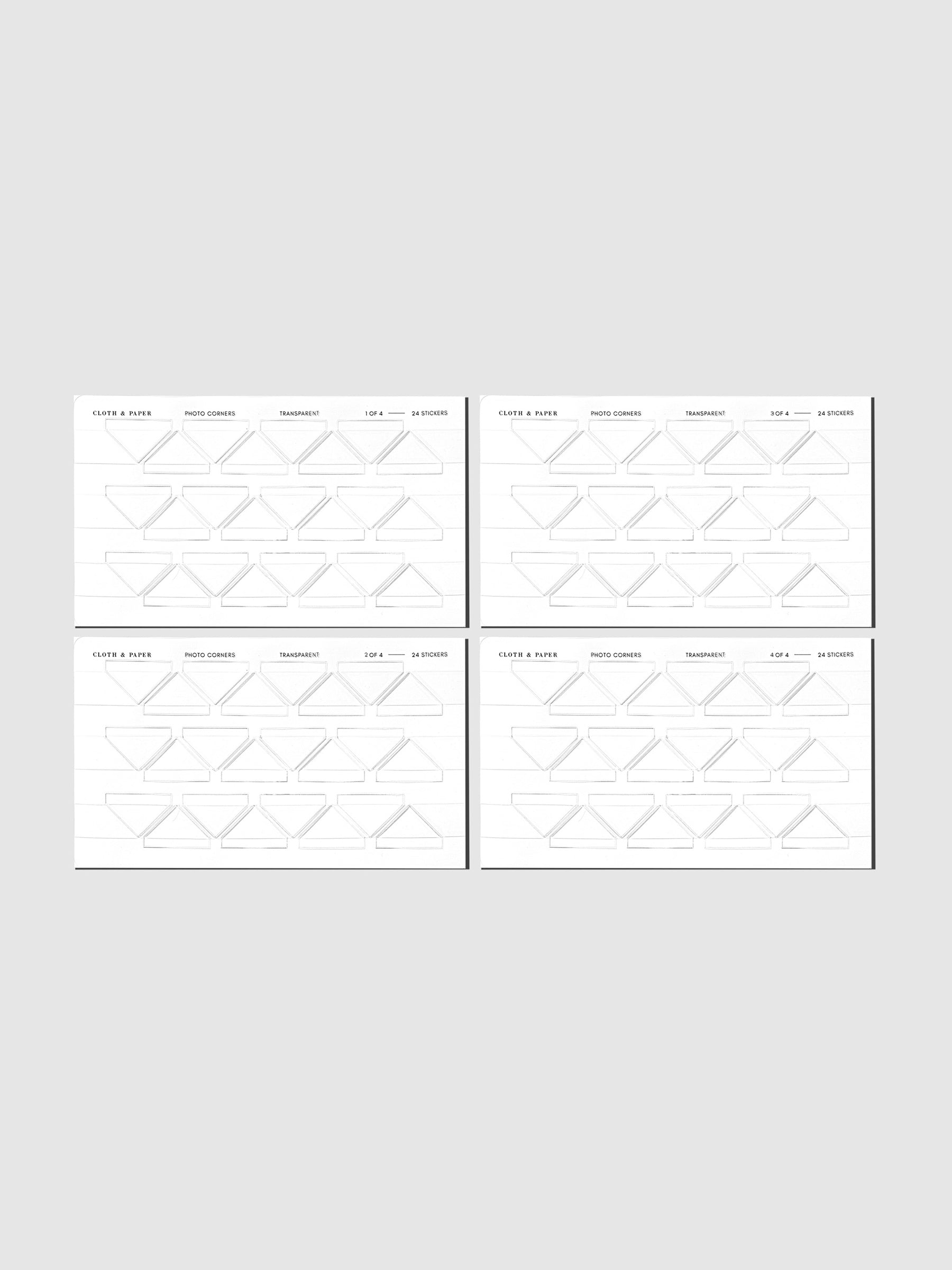 Four clear photo corner sticker sheets displayed in their packaging on a neutral background.
