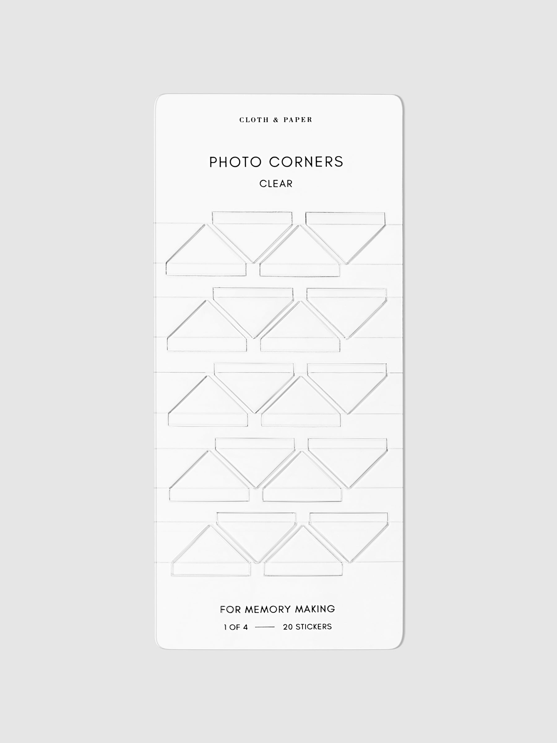 Clear photo corners displayed on a neutral background.