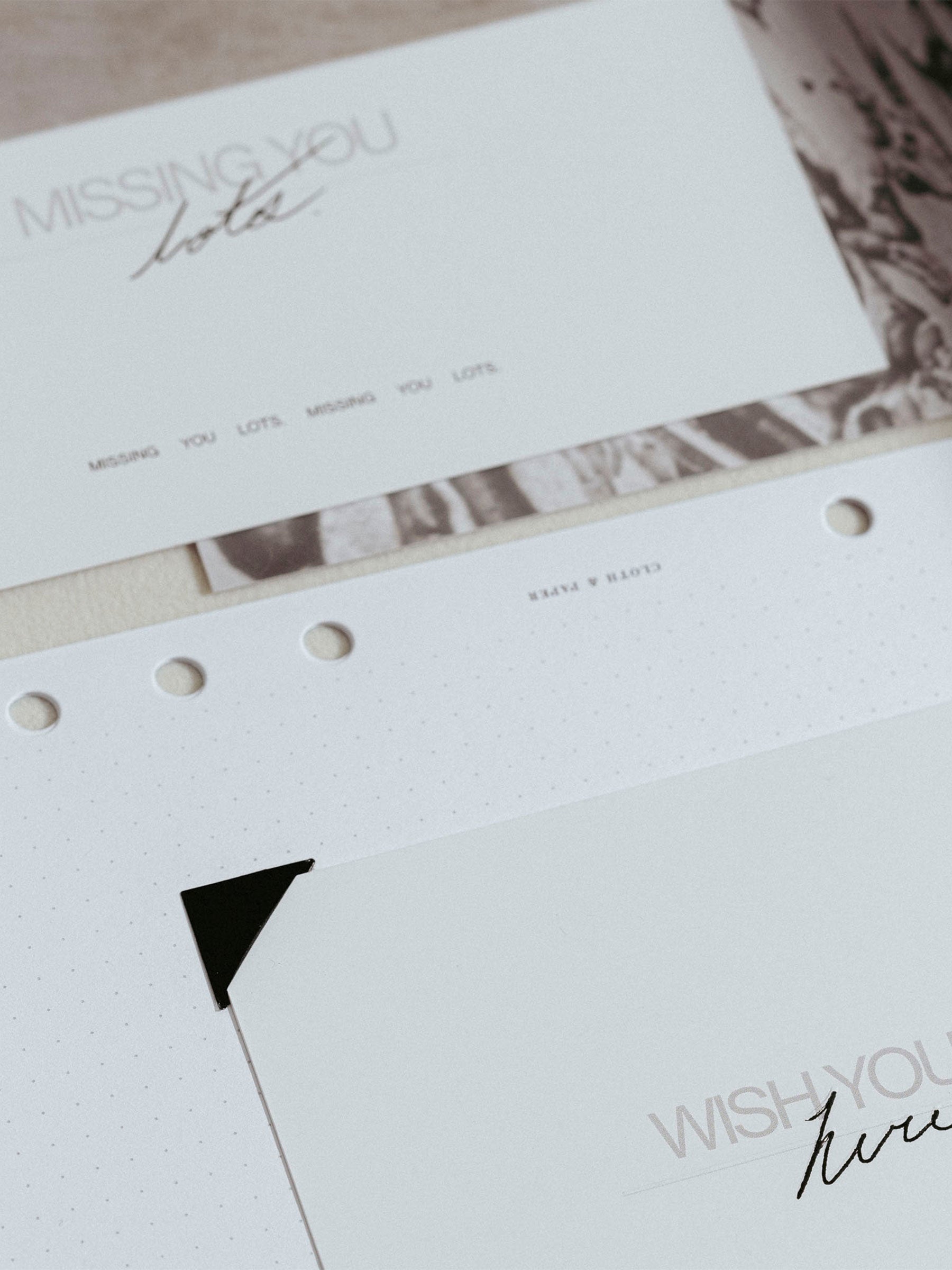 Photo corners shown in use inside a planner insert.