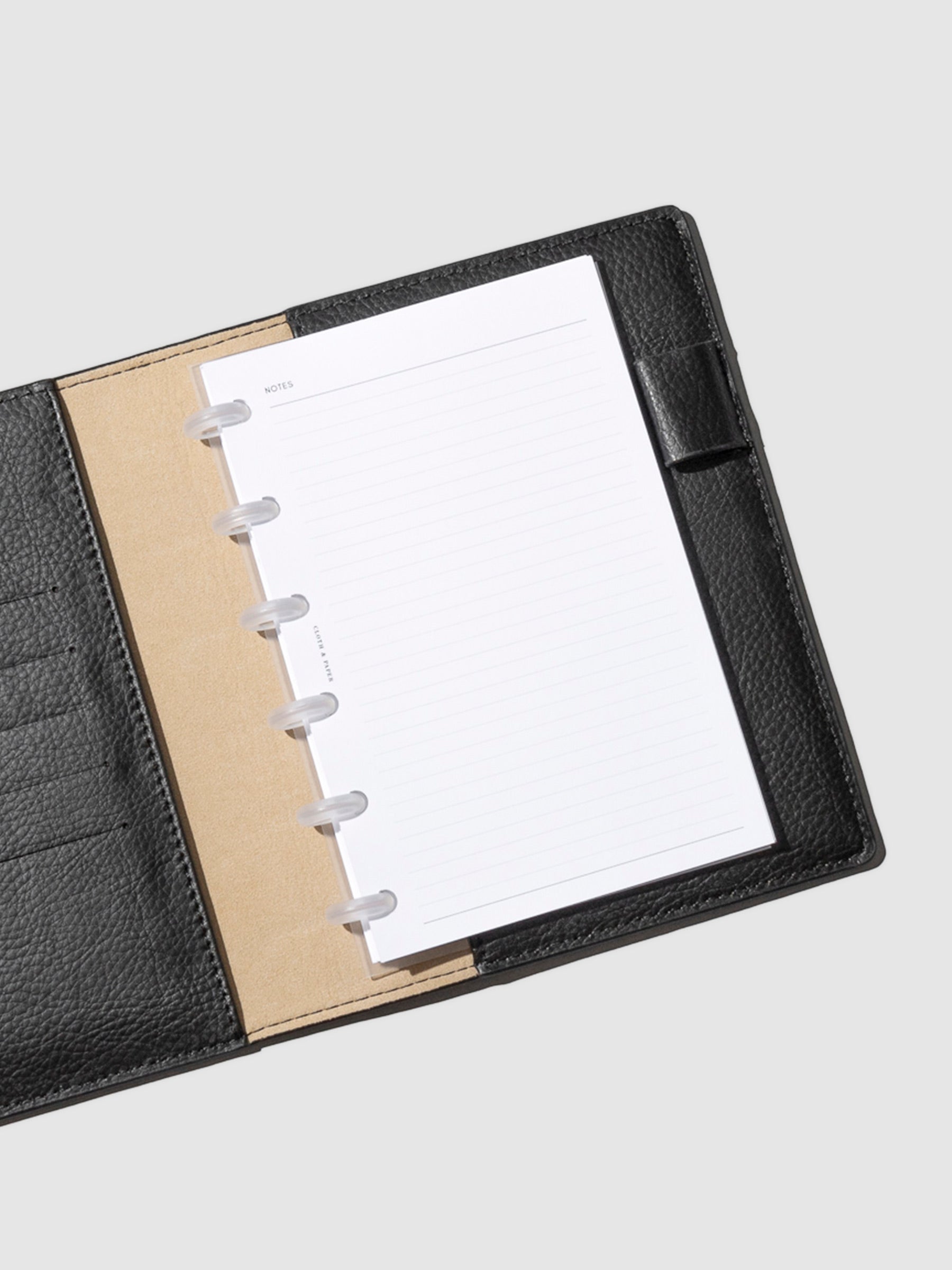 Discs in use inside a black leather agenda.