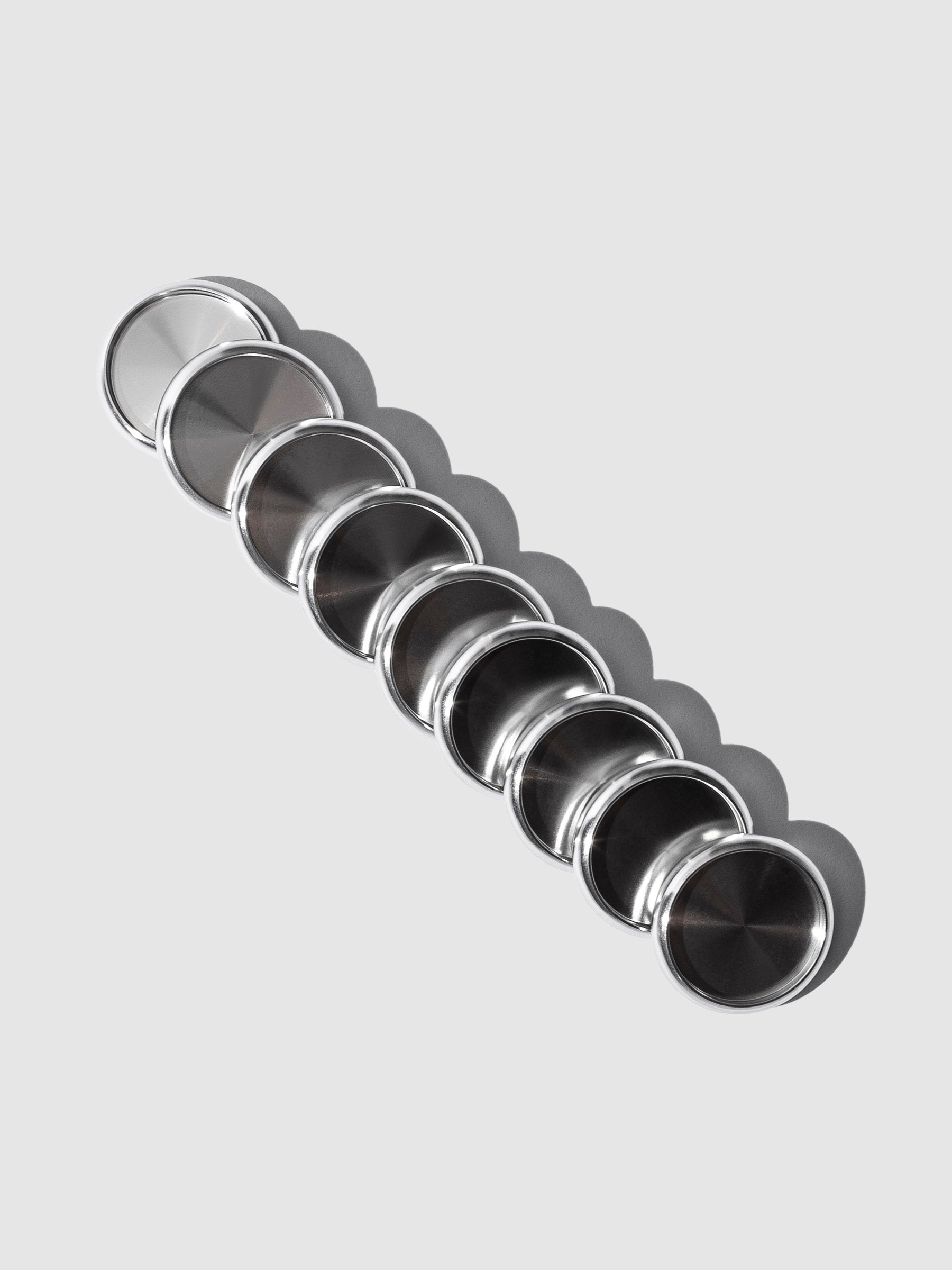 Planner Discs | 1 Inch - Silver, Cloth and Paper. Discs tilted on left displayed on a neutral background.