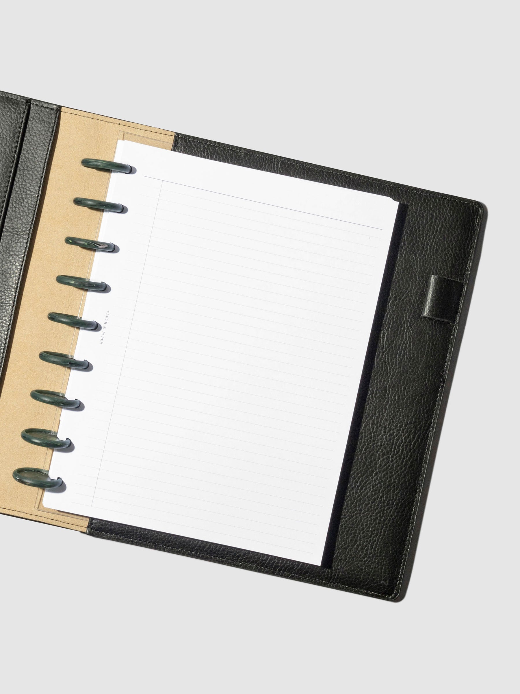 Set of 9 discs in use inside a black leather planner.