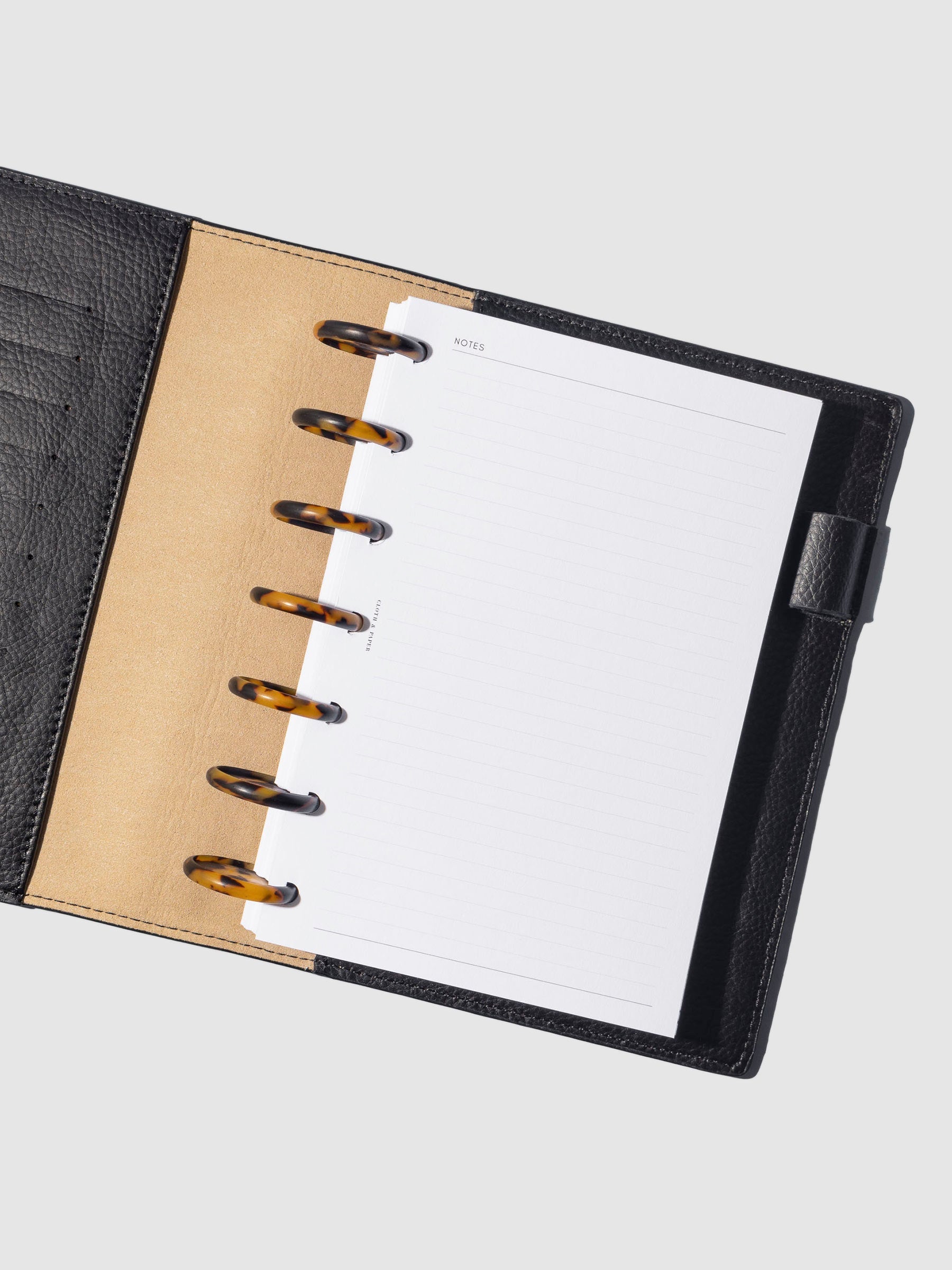 Discs in use inside a leather planner.