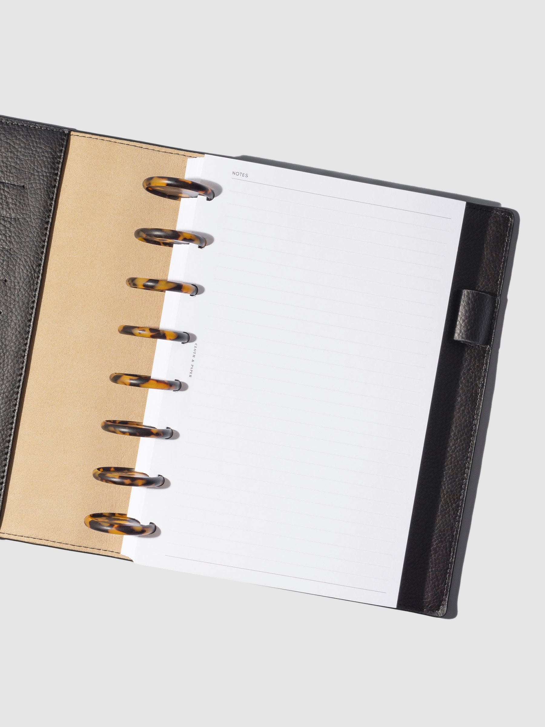 Set of 9 discs in use inside a leather planner.