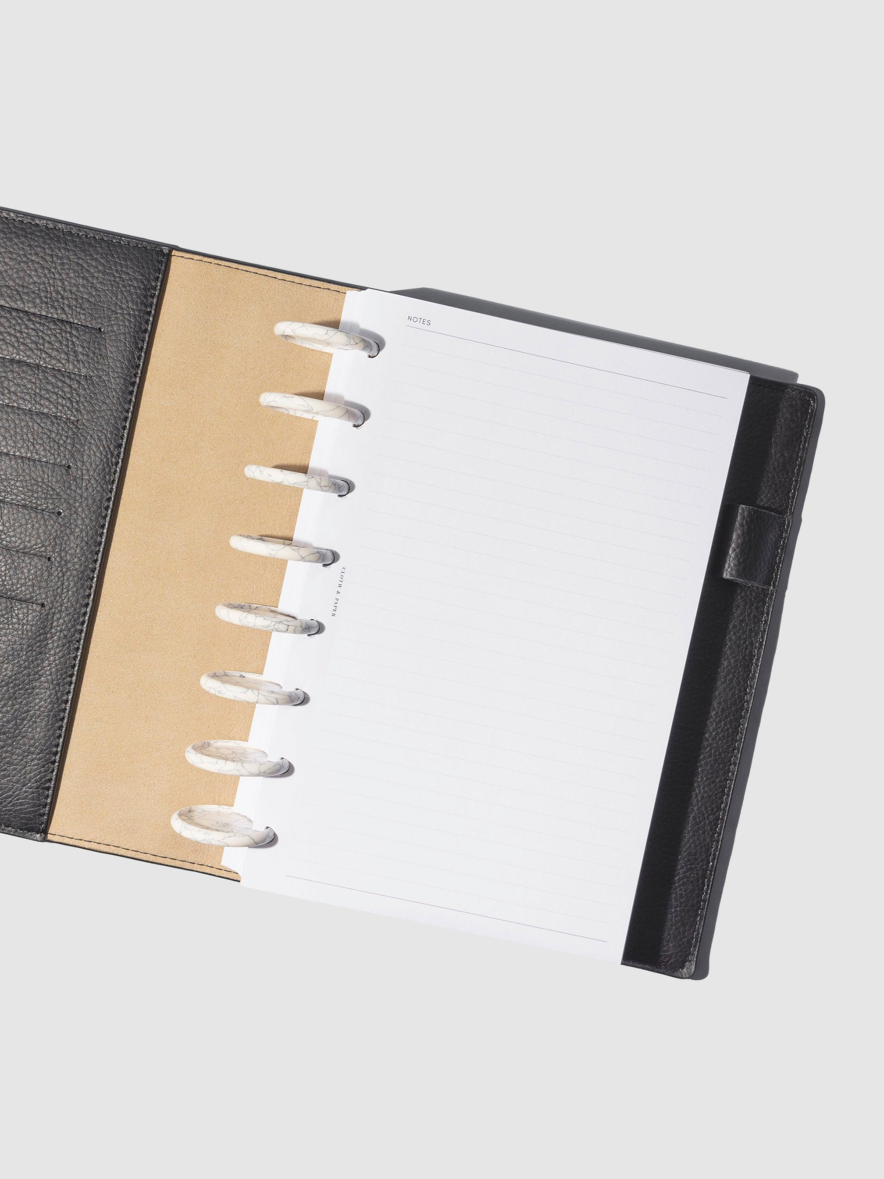 Discs in use inside a leather planner.