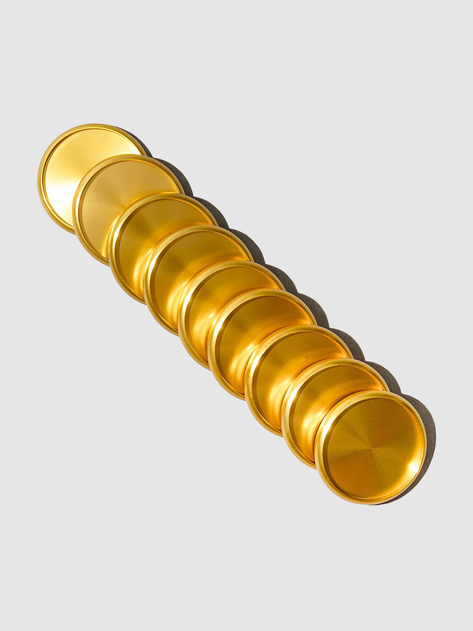 Gold aluminum planner discs, 1.5 inch size, set of nine arranged in packaging.