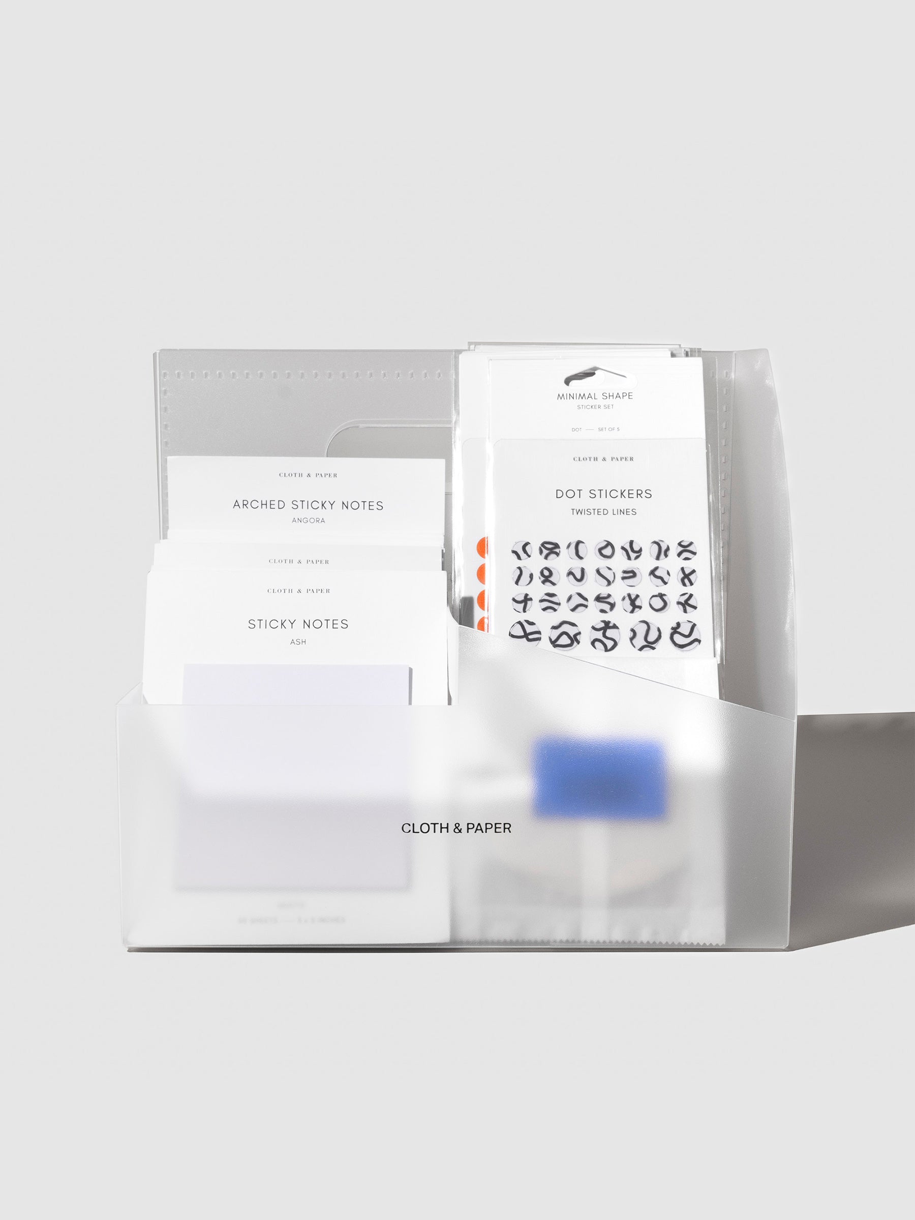 Caddy displayed filled with sticky notes and stickers.