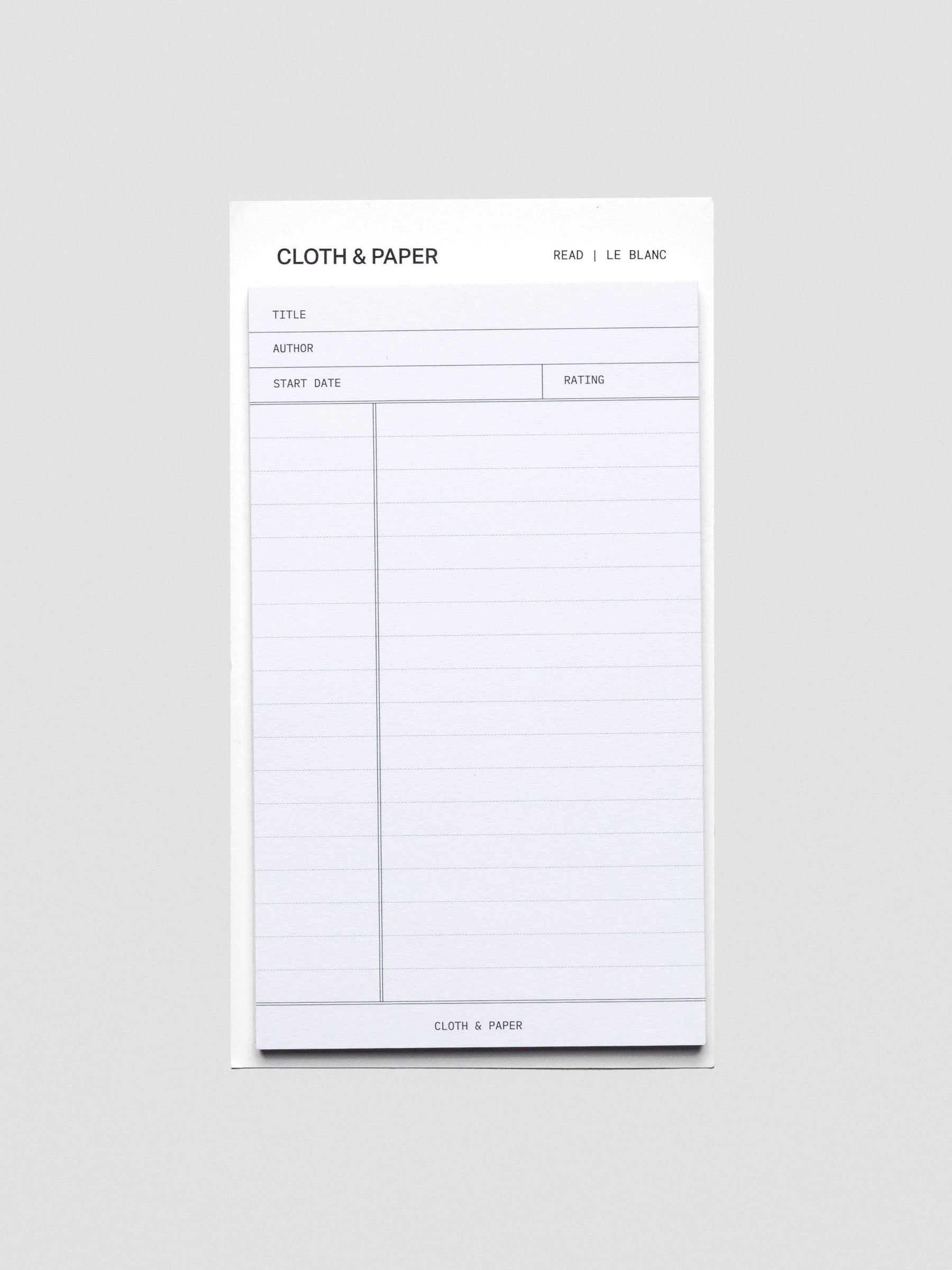 Black and white pad of sticky notes with fields for title, author, start date, rating, and notes section.