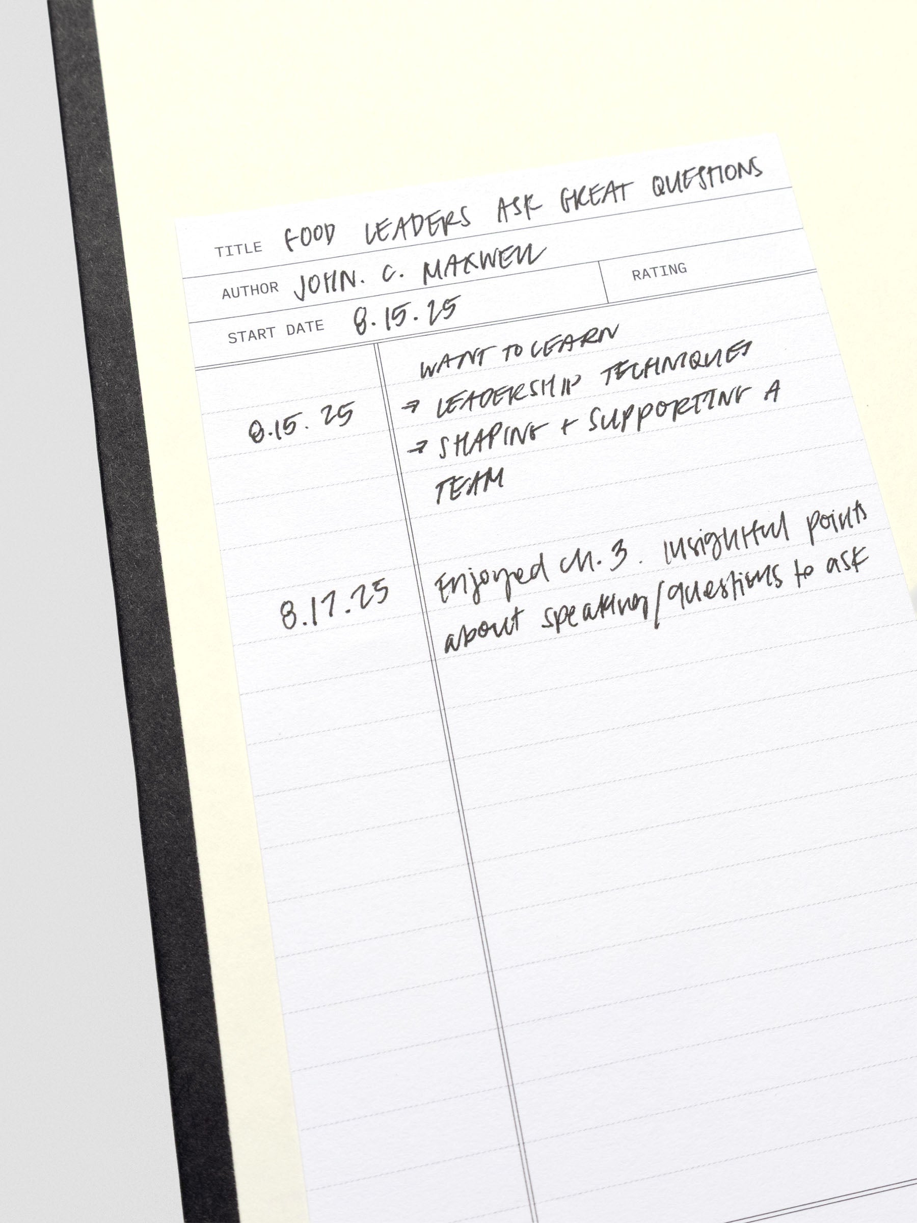 Close up of read sticky note shown adhered to inside of book cover with handwritten notes.