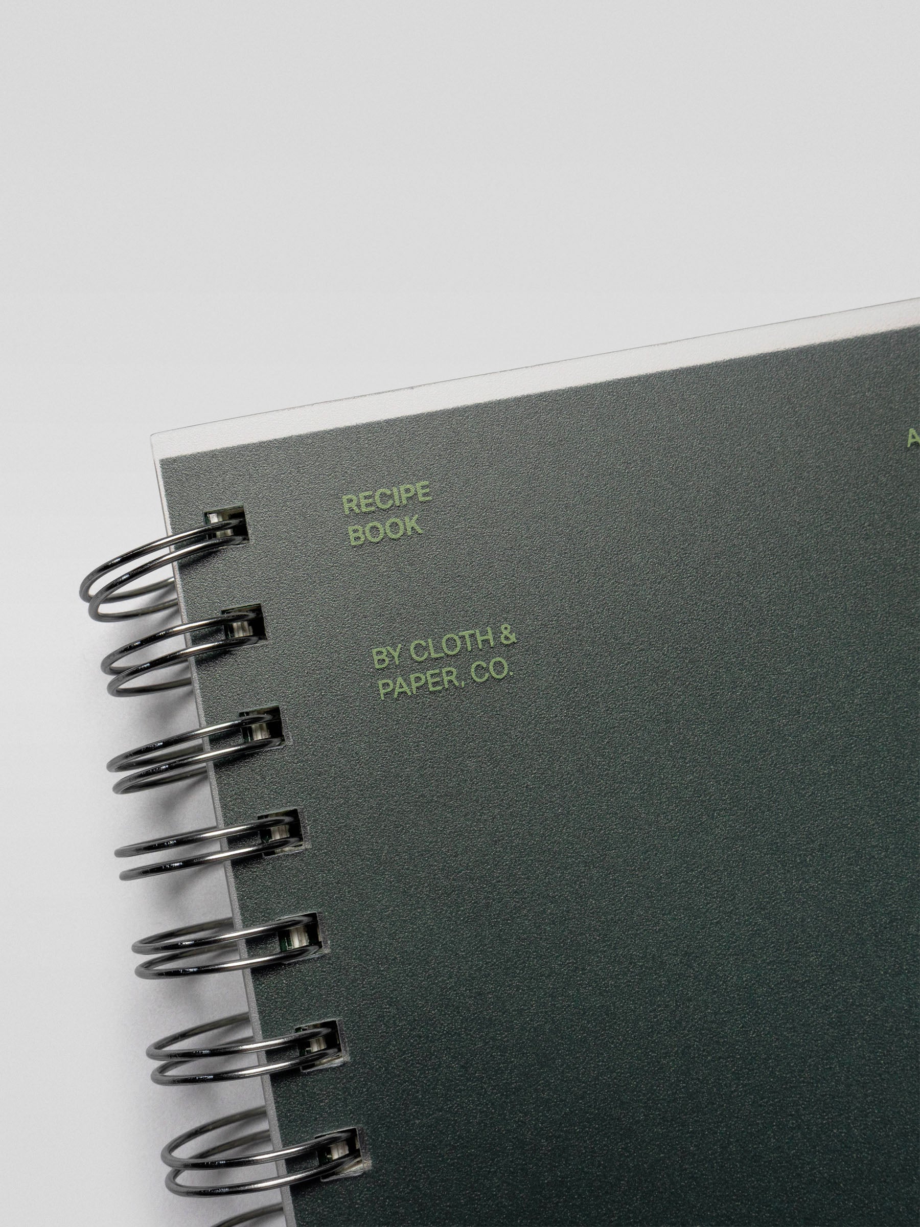 Close-up of the Recipe Book System cover showcasing the text “Recipe Book by Cloth & Paper Co.” in green lettering.