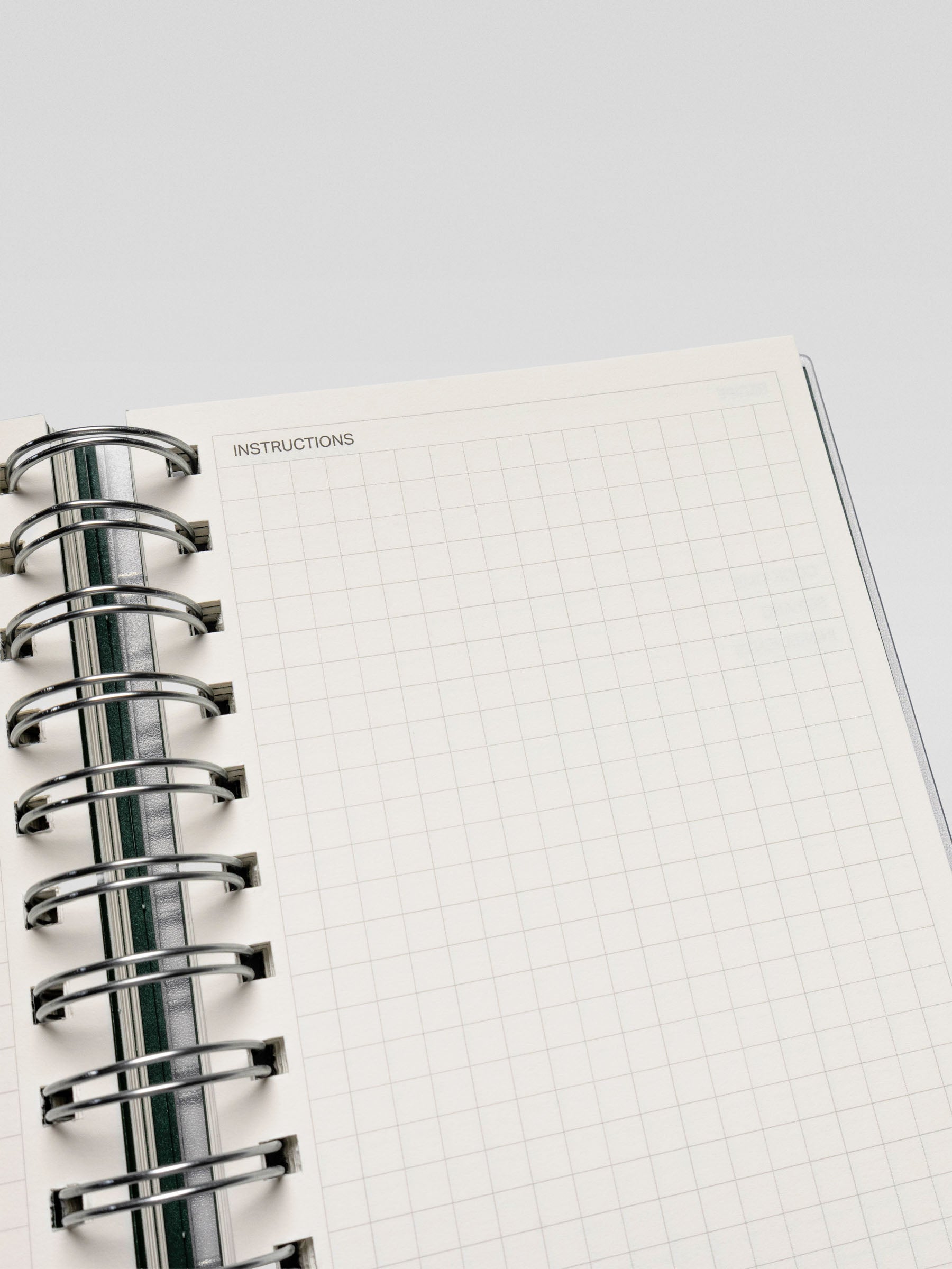 Close-up of the opposite recipe page in the Recipe Book System, with a grid section labeled "Instructions" for writing cooking directions.