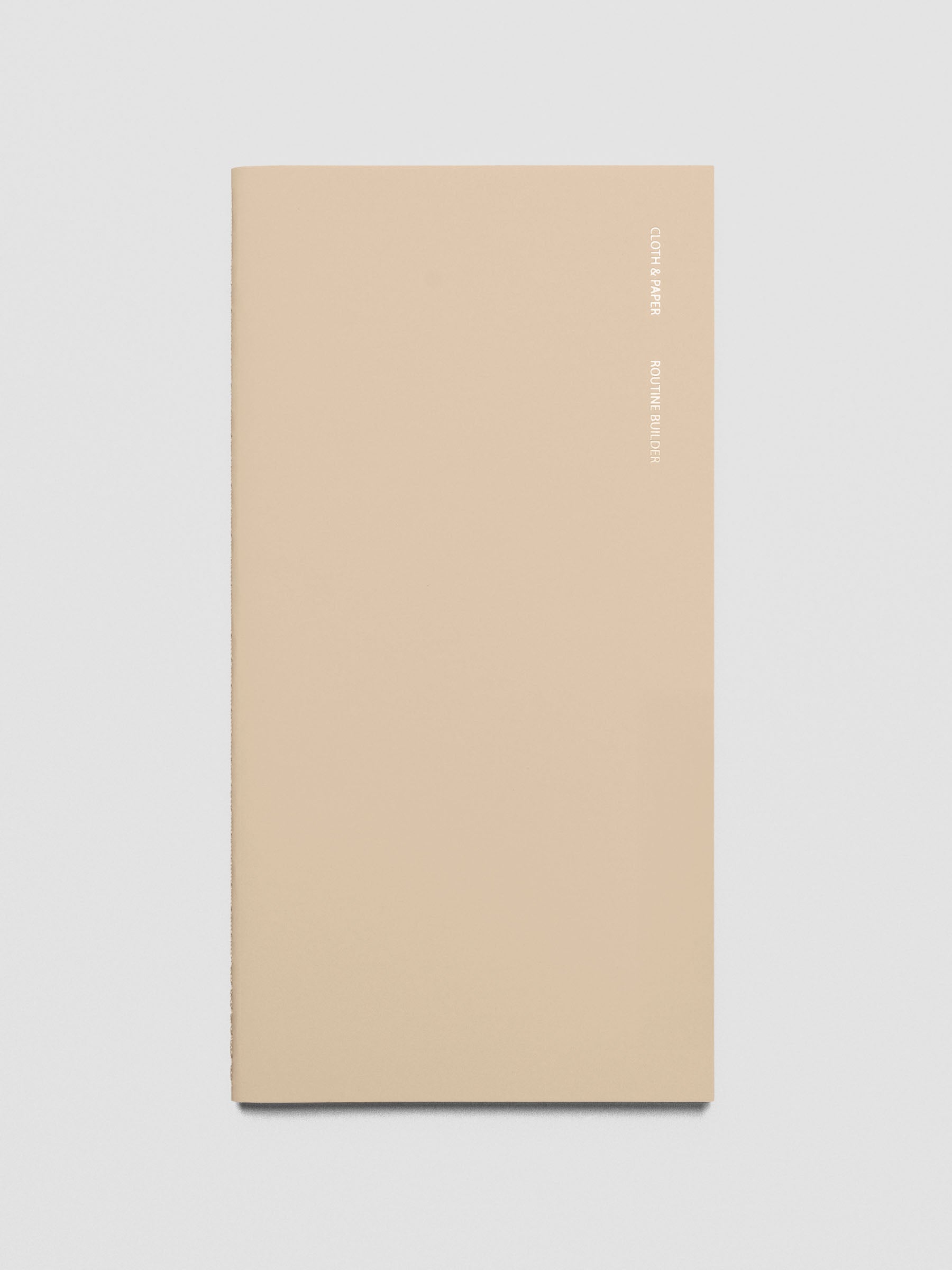 Travel Notebook in size A5 Slim in color Beignet with Routine Builder pages shown from the front as a close up.