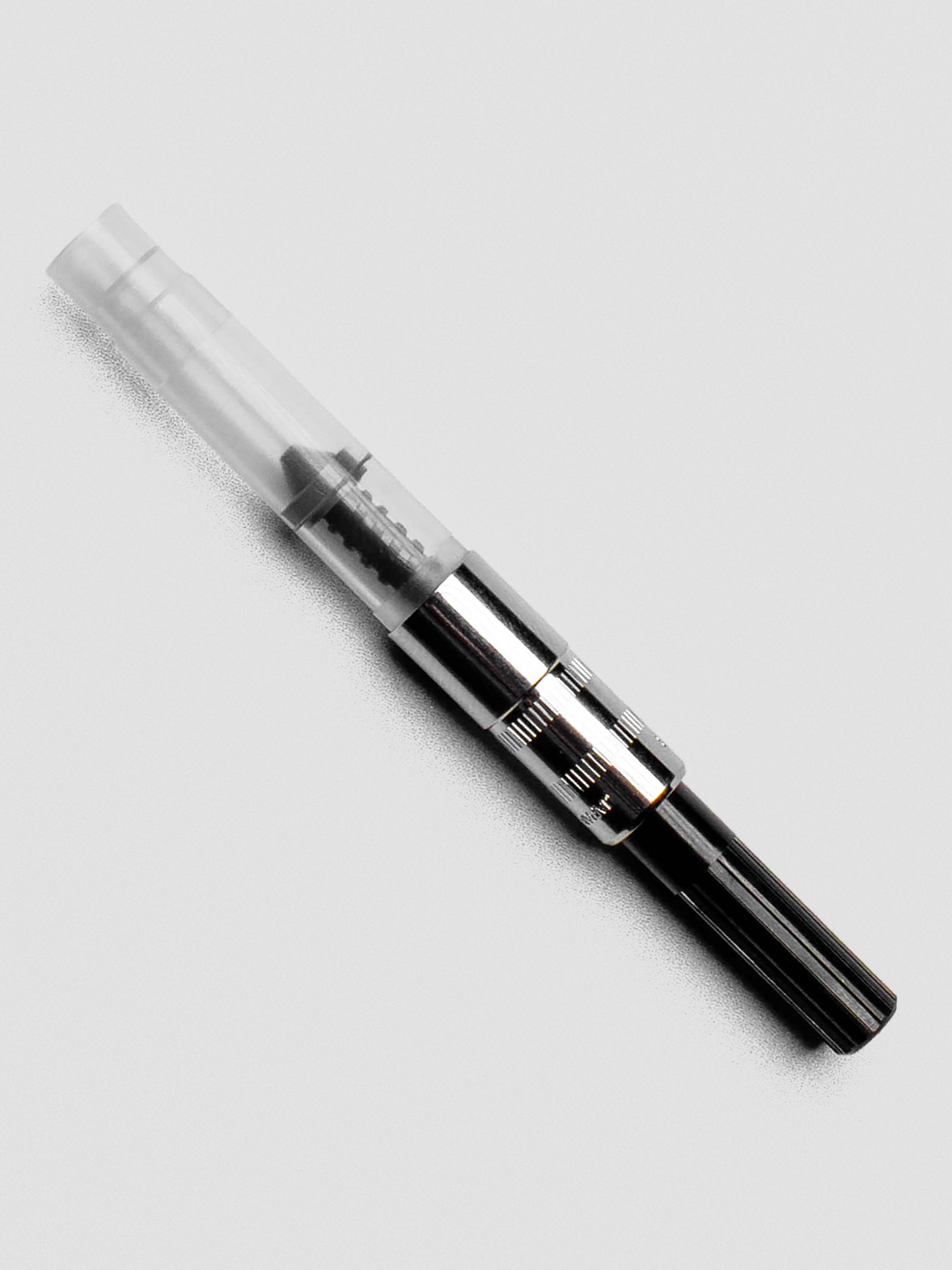 Sailor Standard Ink Converter shown capped and compact with clear barrel and silver fittings.