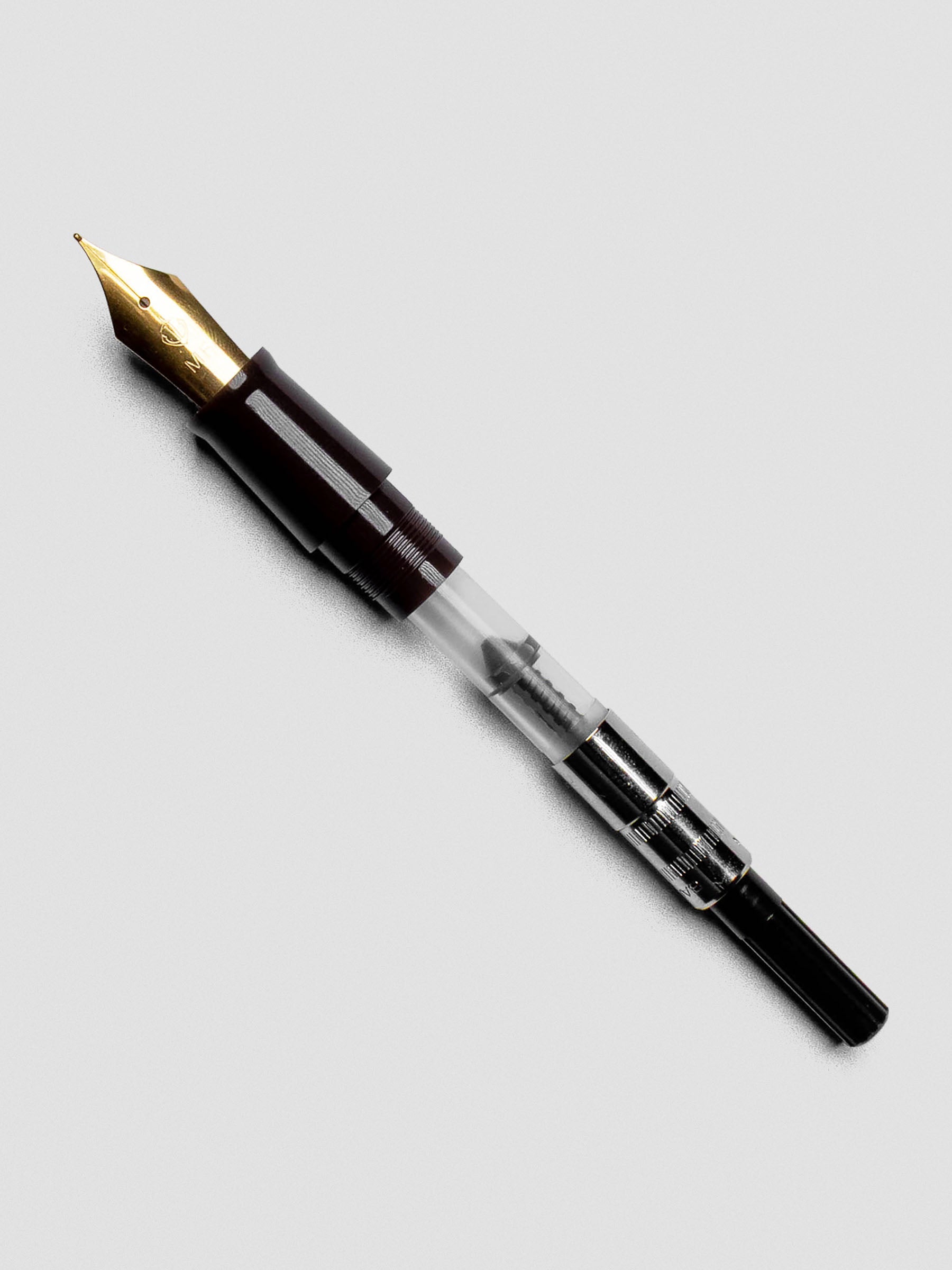 Sailor Standard Ink Converter displayed at an angle to show screw-style filling system.