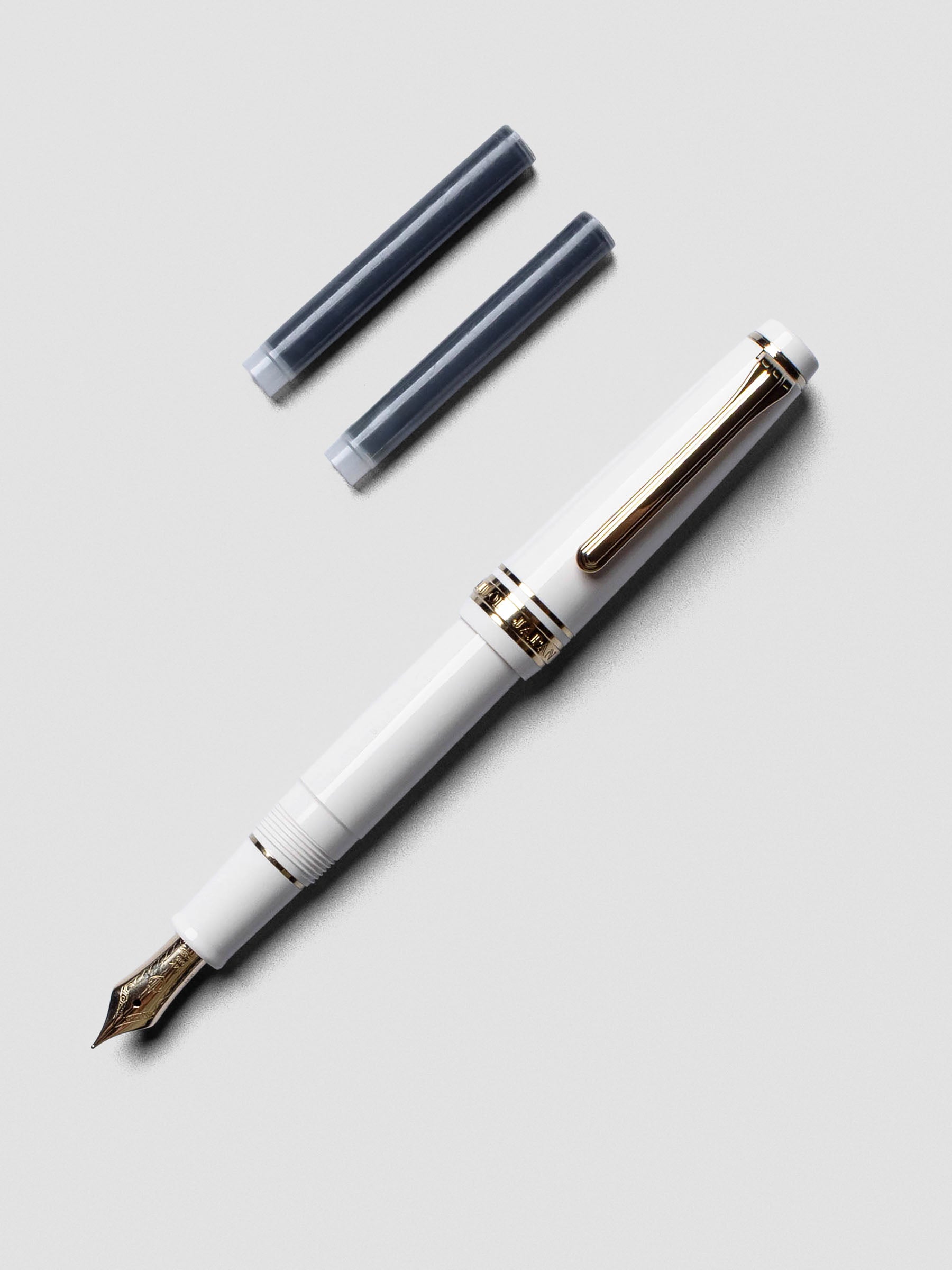 Sailor Pro Gear Slim Mini Fountain Pen in Beni White with cap posted on barrel.