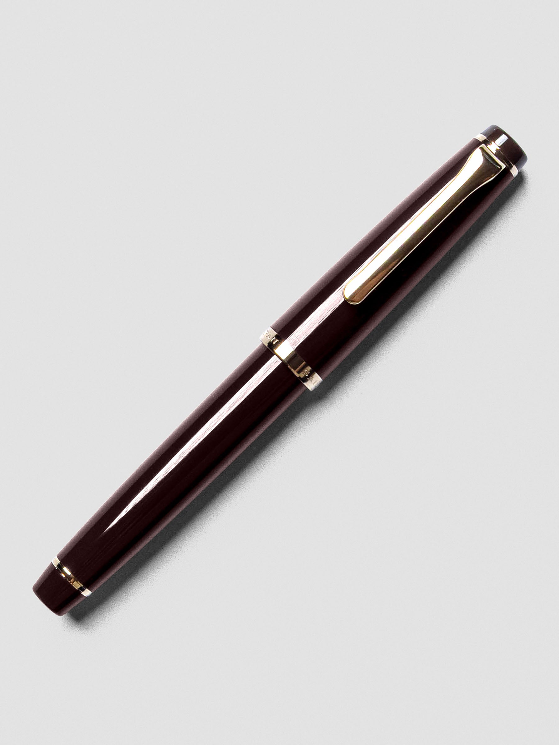 Sailor Recle Fountain Pen Medium in Ruby Red shown capped with resin body.
