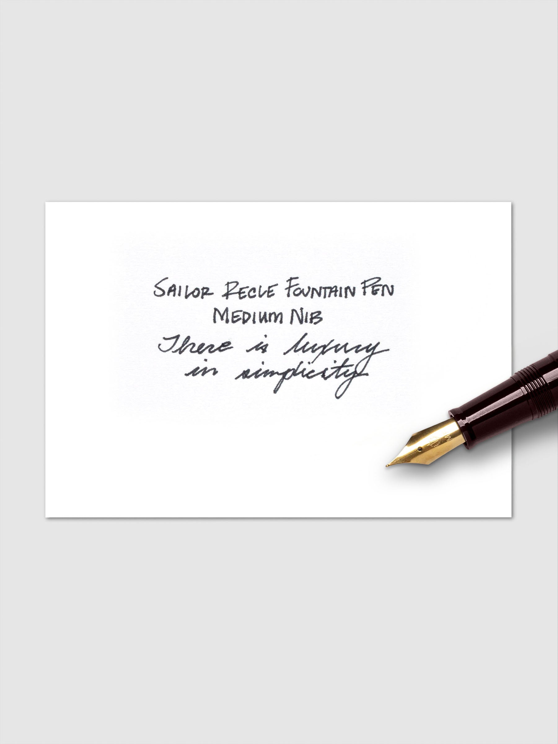 Sailor Recle Fountain Pen Medium in Ruby Red displayed at an angle uncapped.