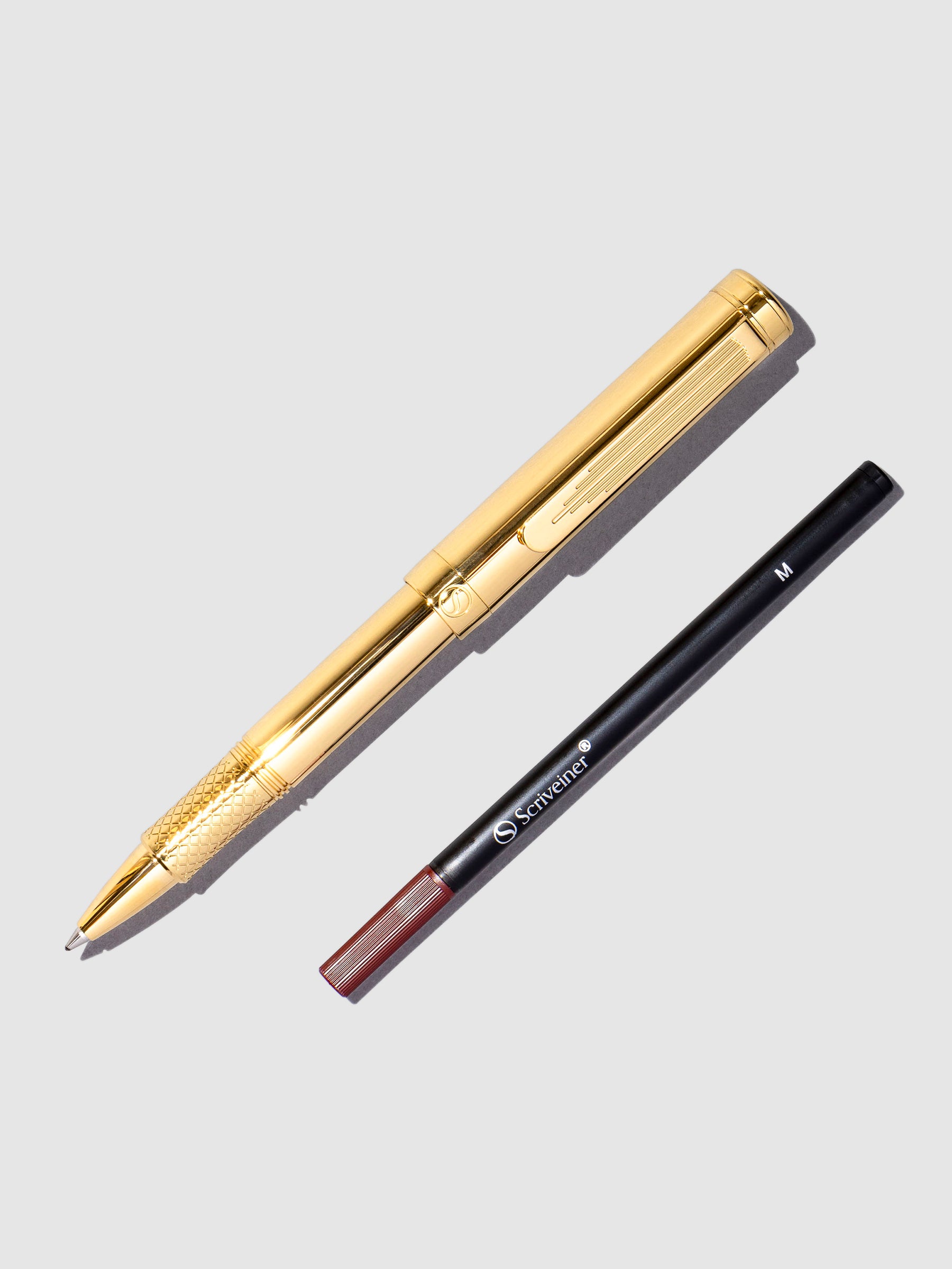 Scriveiner EDCGold Roller ballpen displayed on a neutral background.