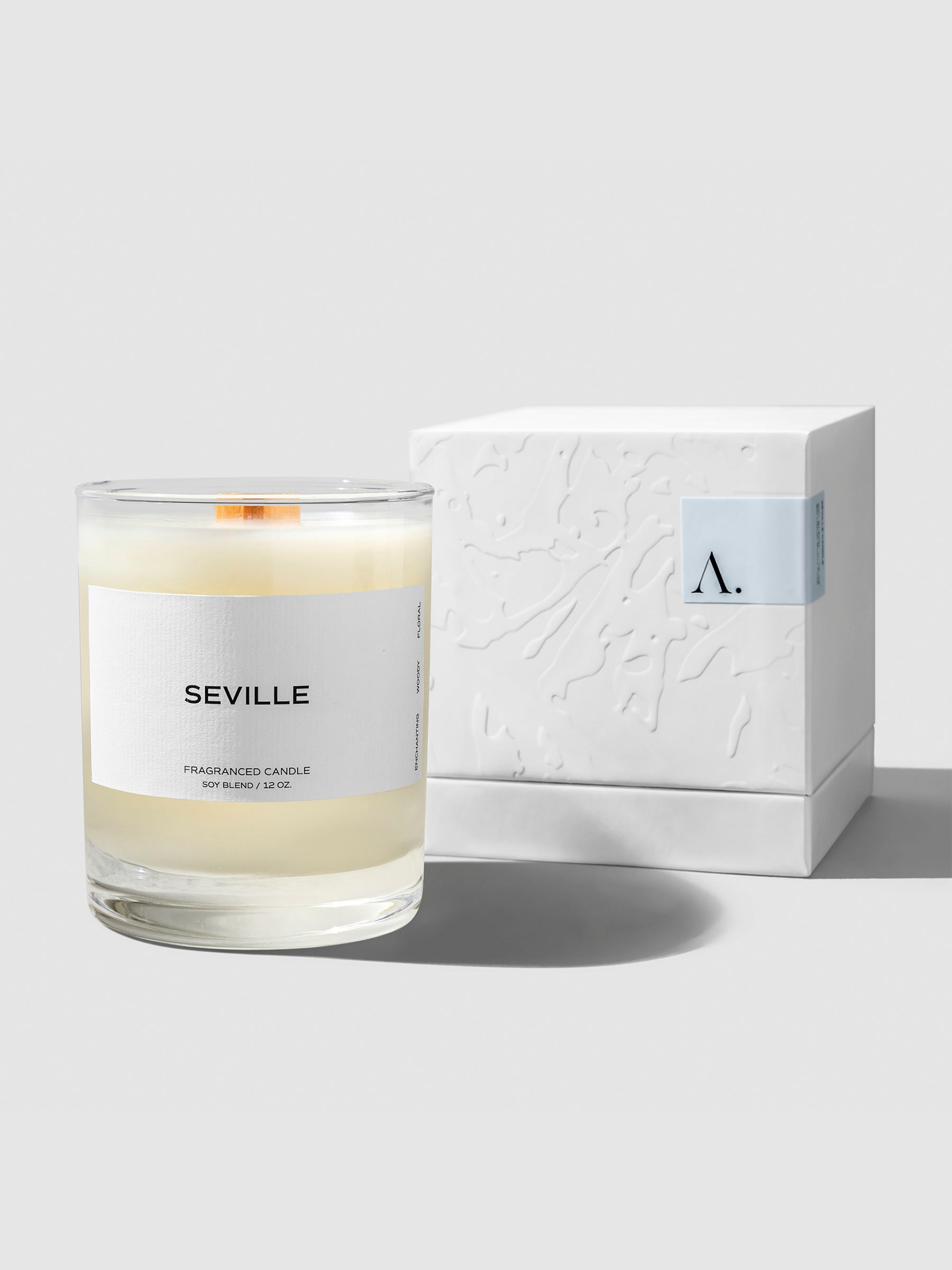Candle displayed next to its box on a neutral background.