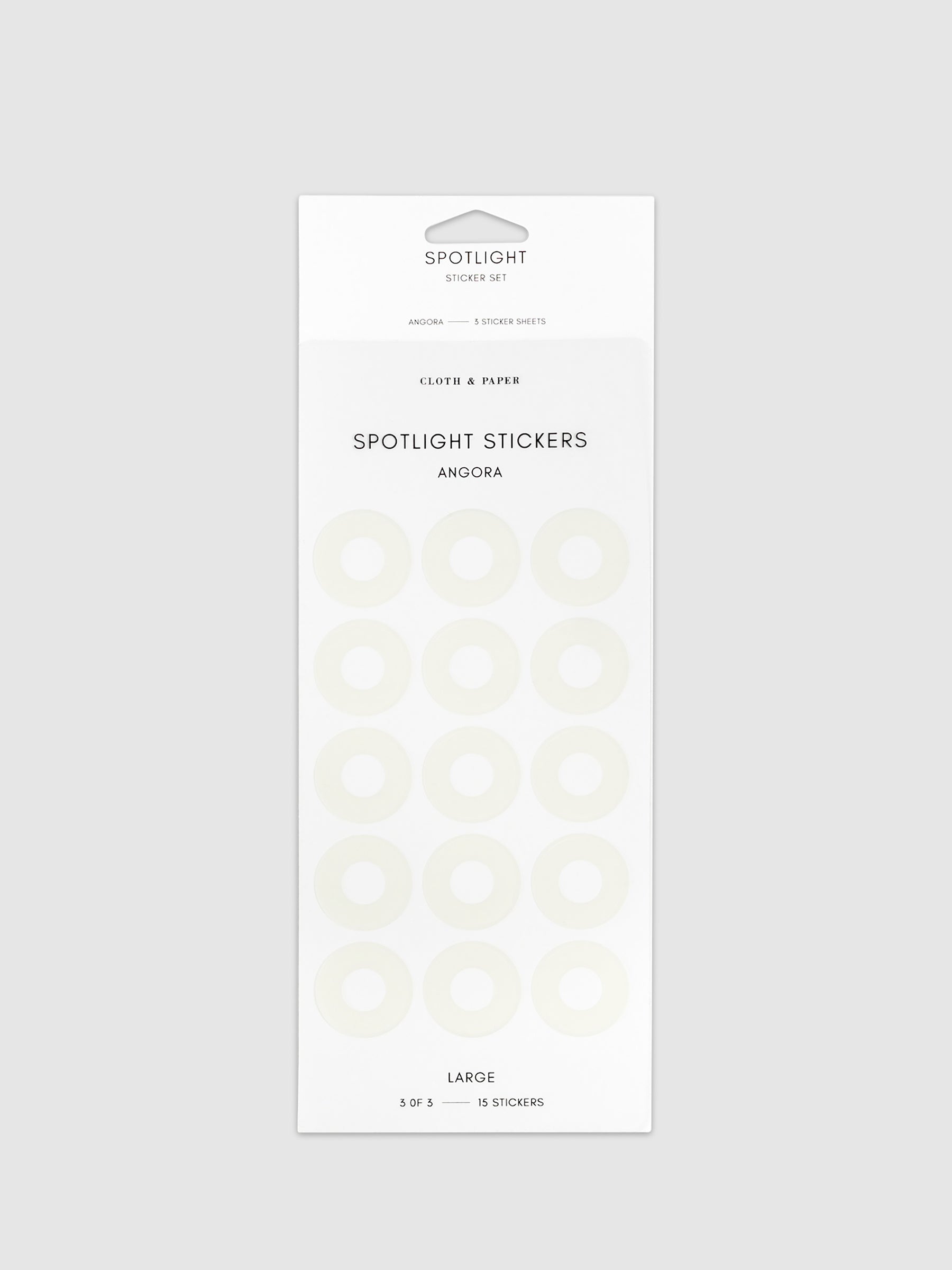 Large spotlight stickers in Angora on a neutral background.