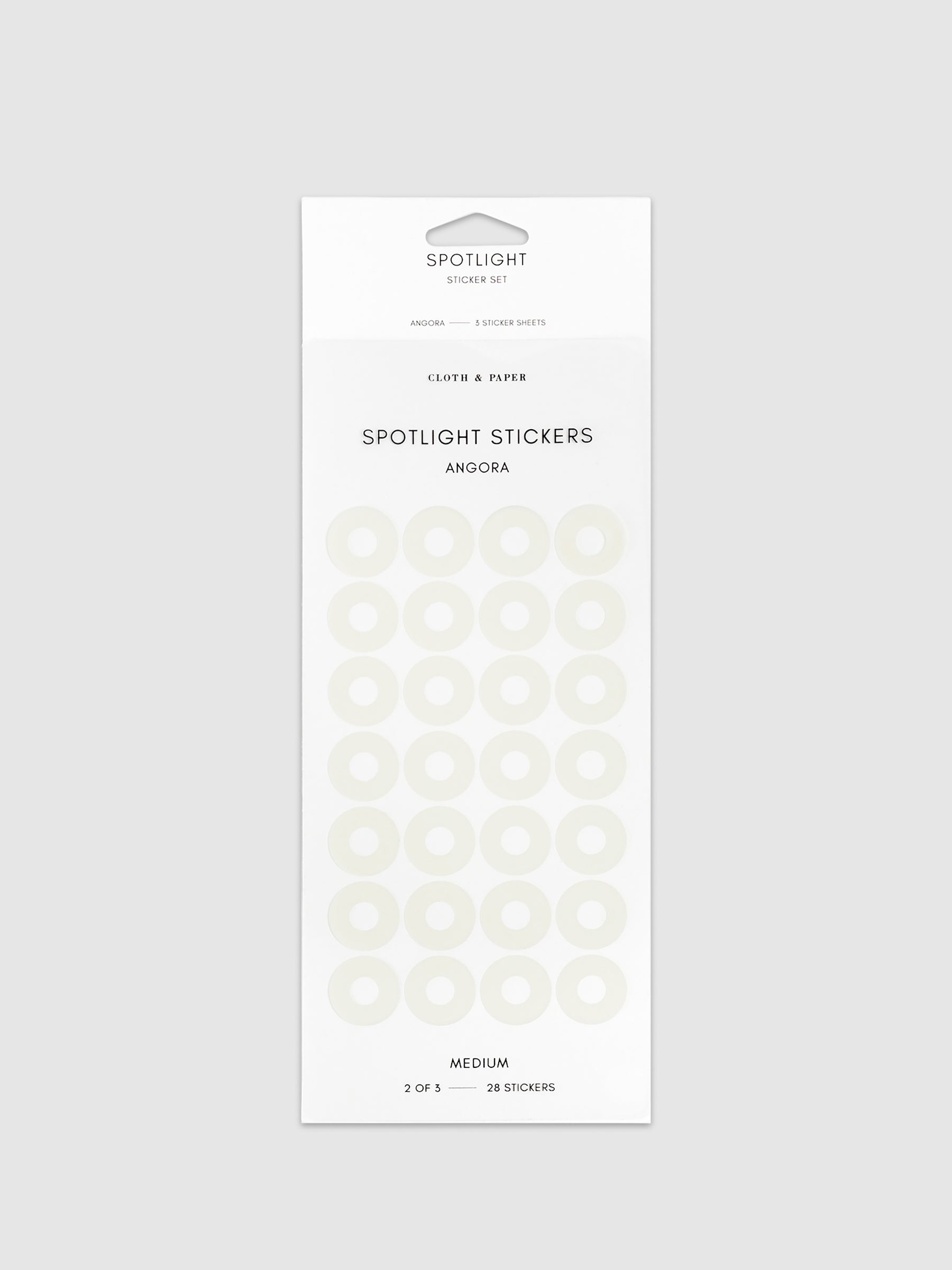Medium spotlight stickers in Angora on a neutral background.