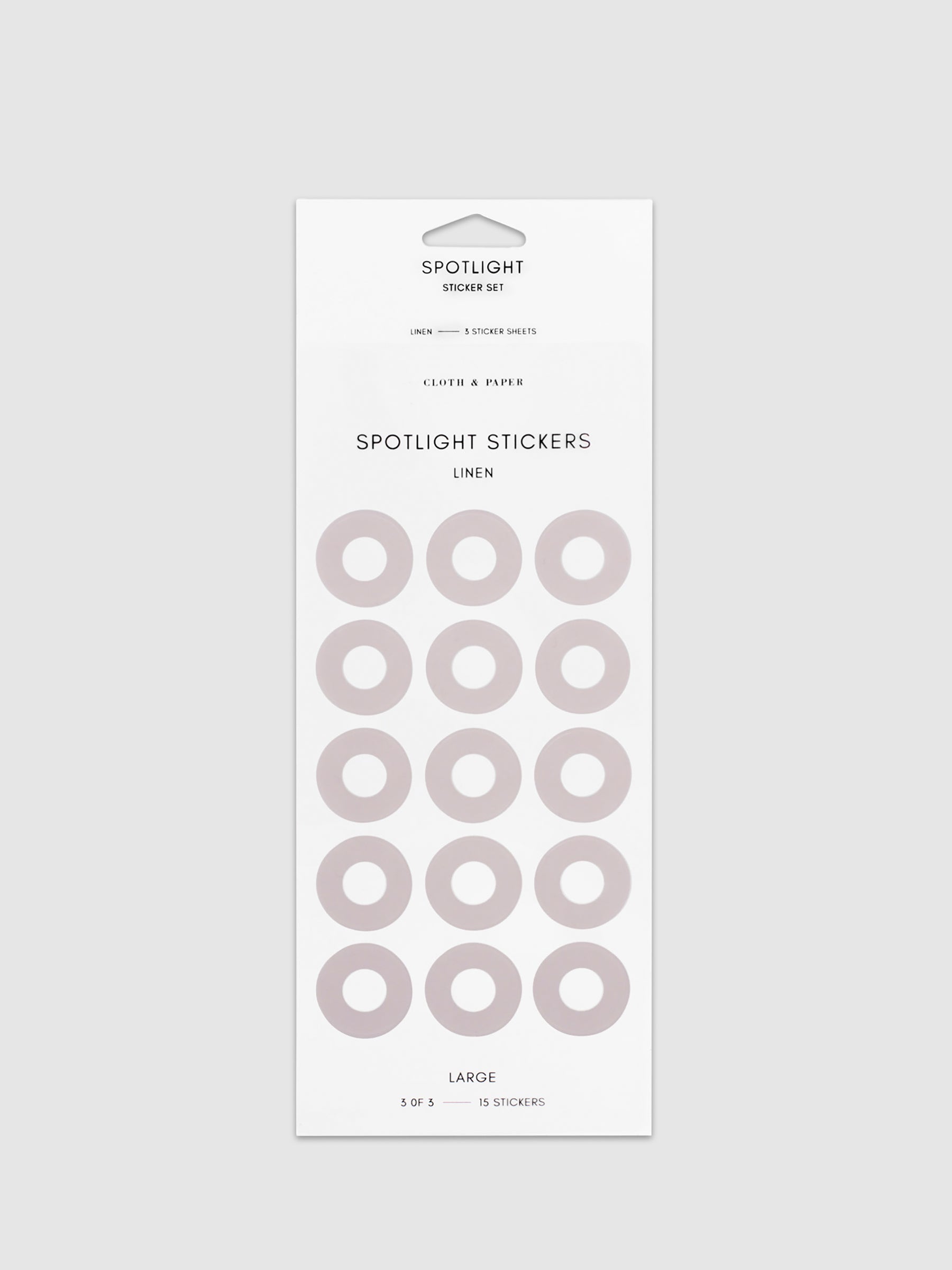 Large sticker in its packaging displayed on a neutral background. Pictured color is linen.