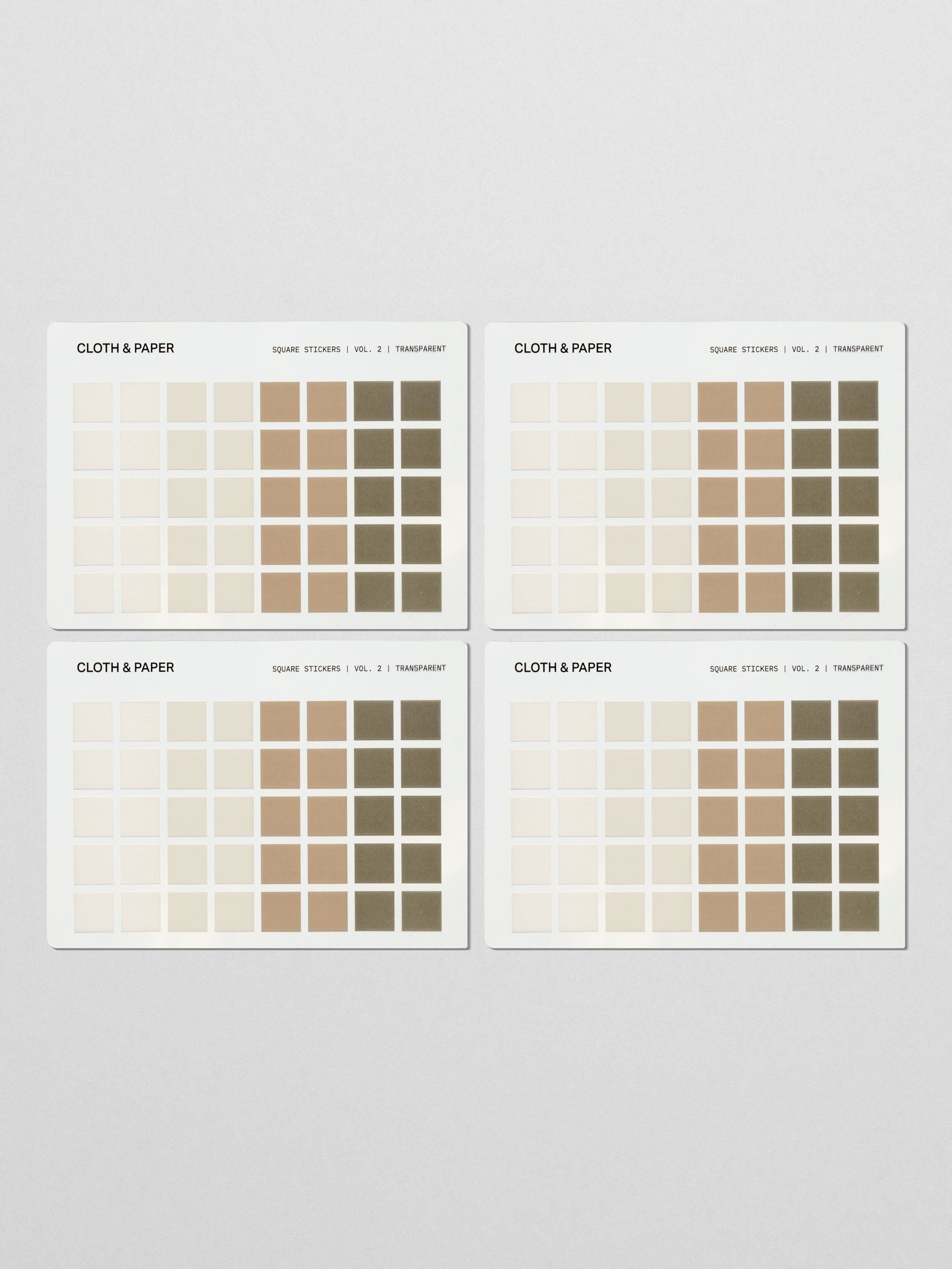 Four sticker sheets of Square Stickers Vol. 2 laid flat, displaying a grid of earth-toned squares in an ombré arrangement.