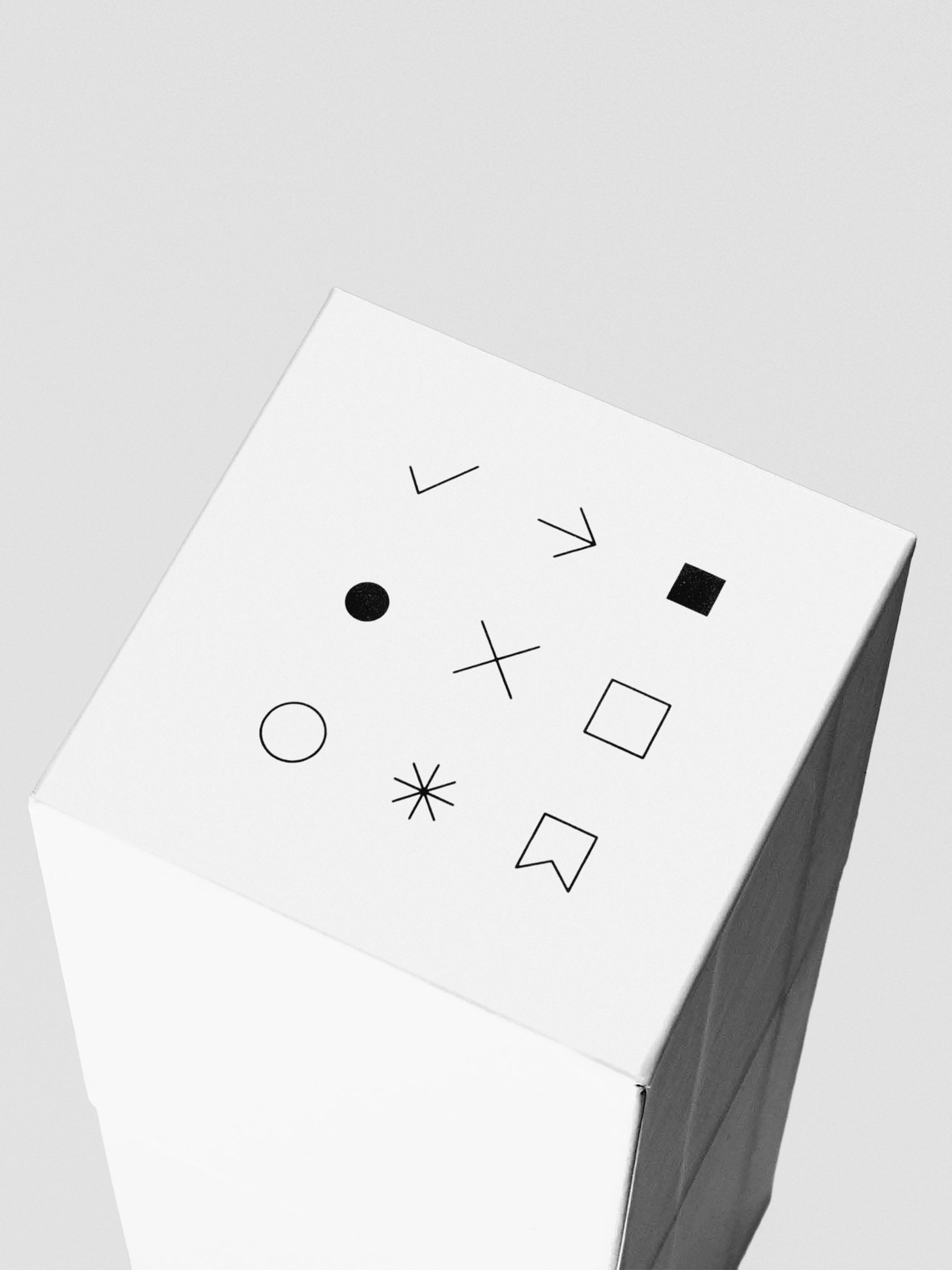 Top view of the Stamp Sticks Set box lid showing a grid of nine simple black icons, each representing a stamp design.