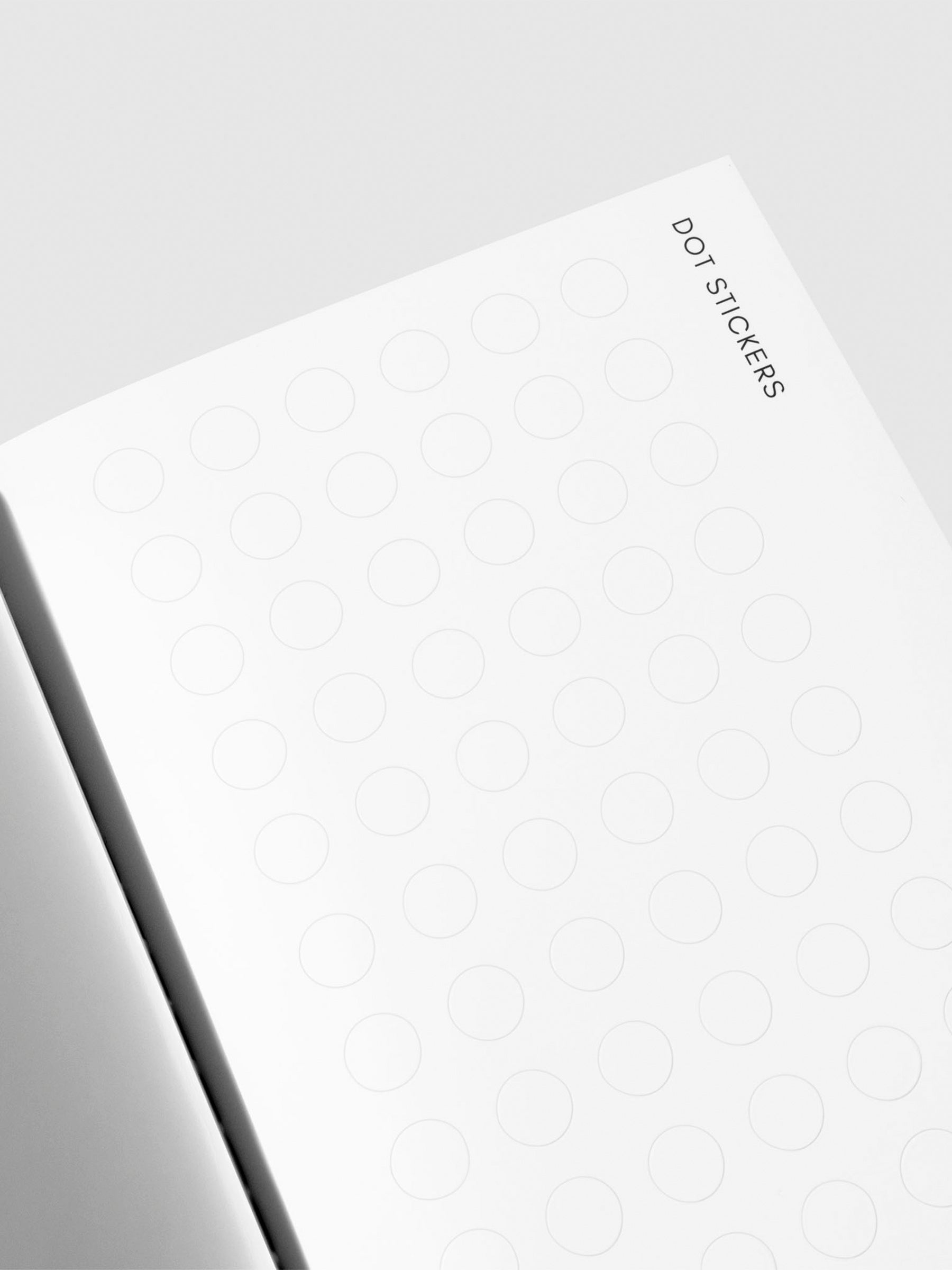 Closeup of white dot sticker page.
