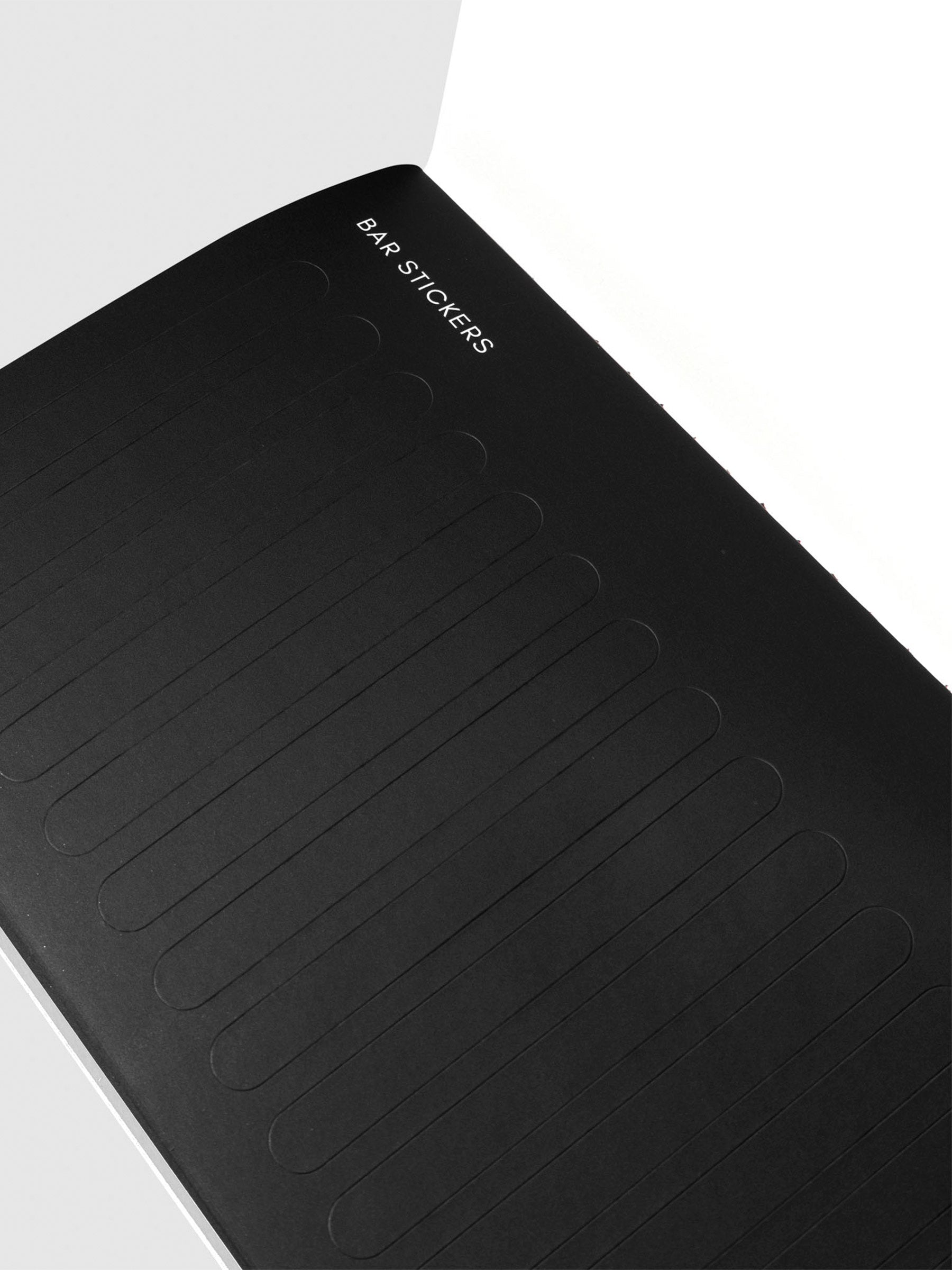 Closeup of black bar sticker page.