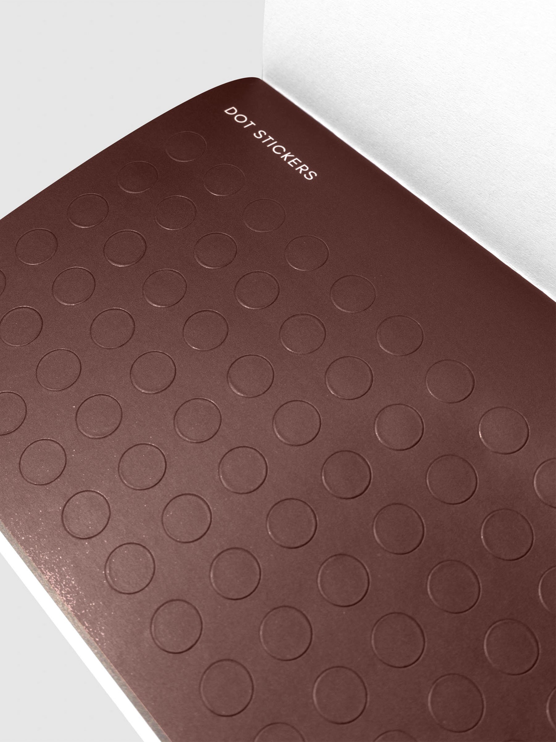 Closeup of maroon dot sticker page.