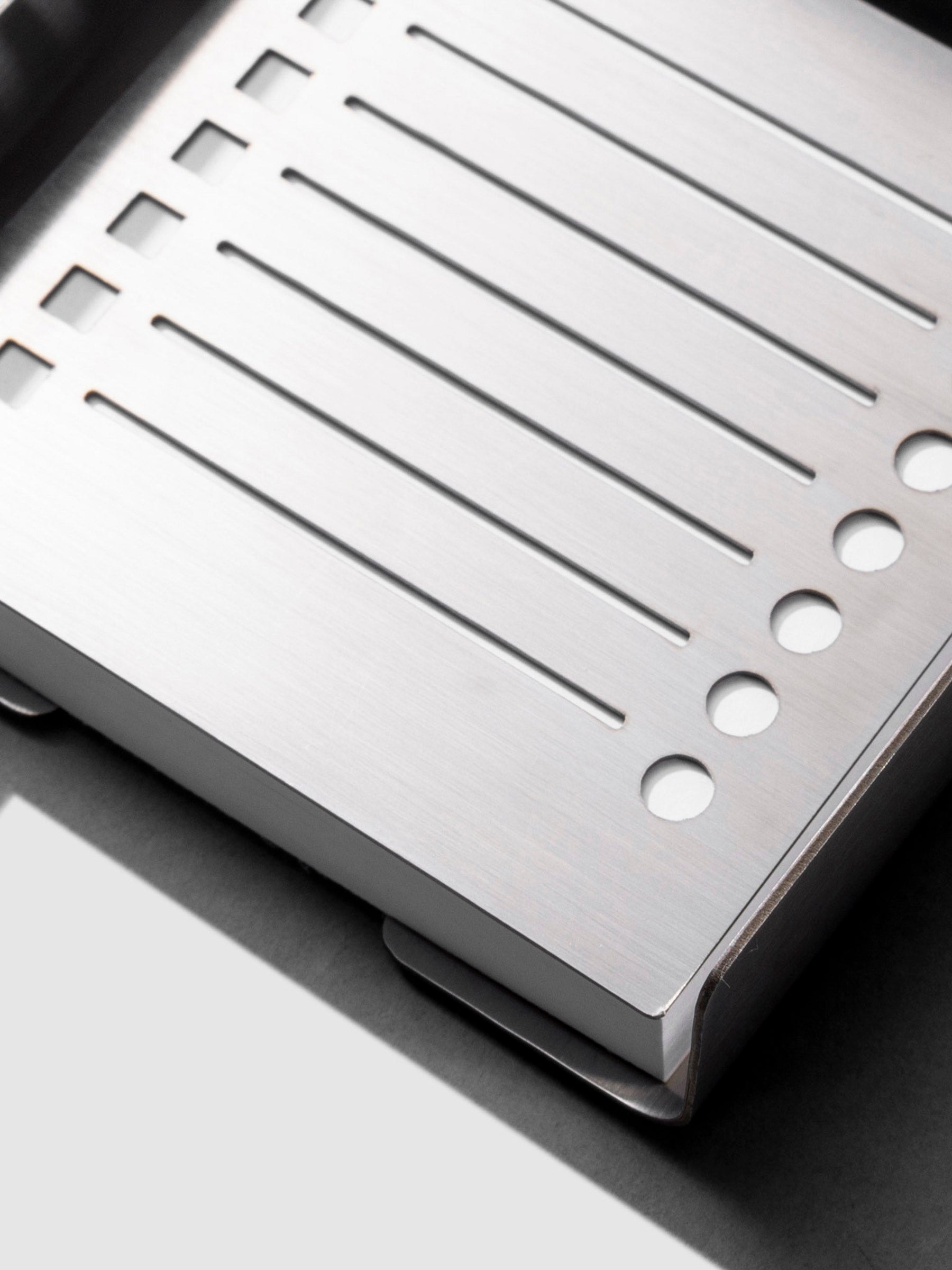 Sticky note holder displayed on a neutral background with stencil placed inside.