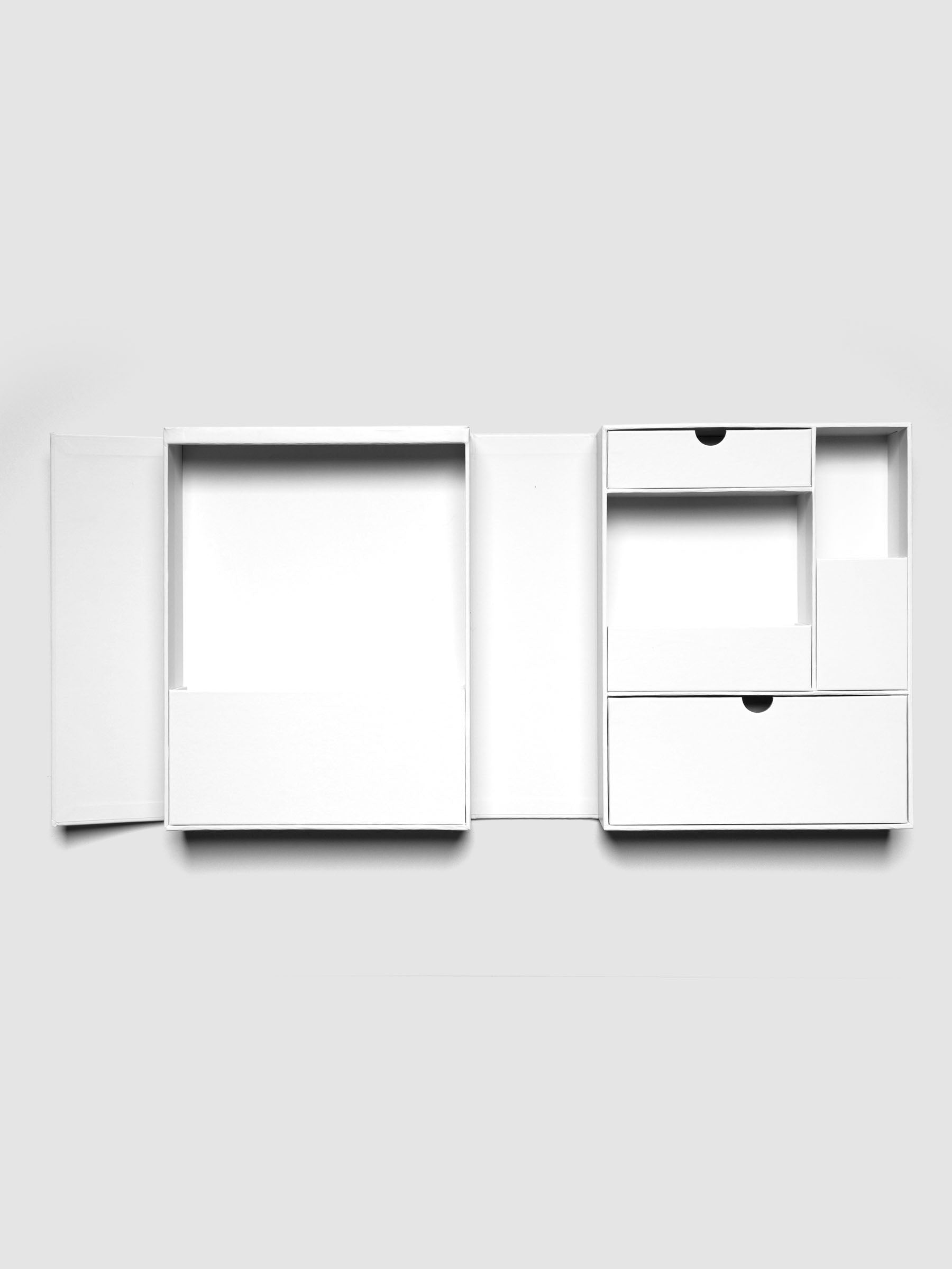 Storage Book 4.0 shown empty, open, and laying flat on a neutral background.