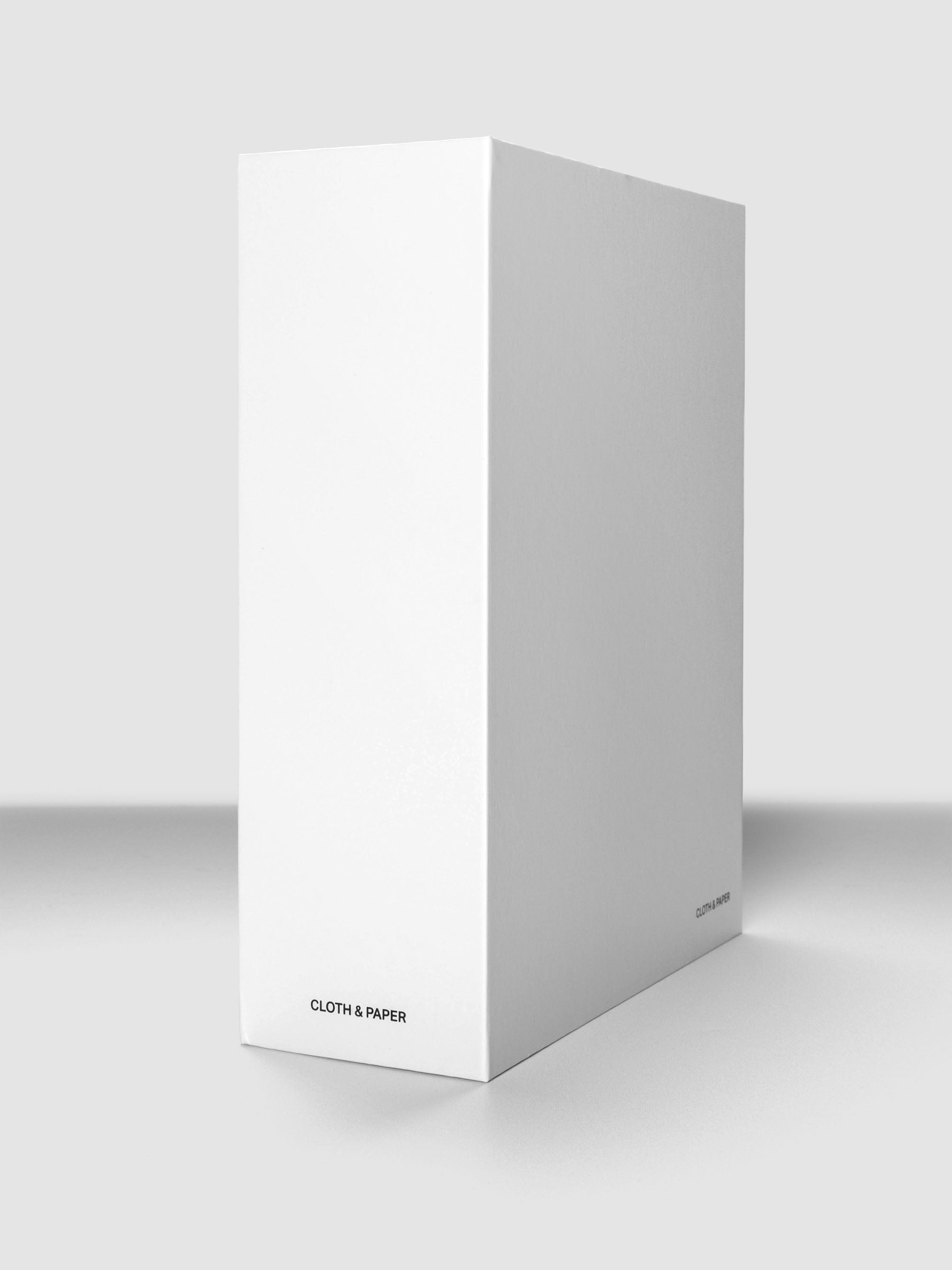 Storage Book 4.0 shown closed, standing, on a neutral background with Cloth & Paper logo on spine.