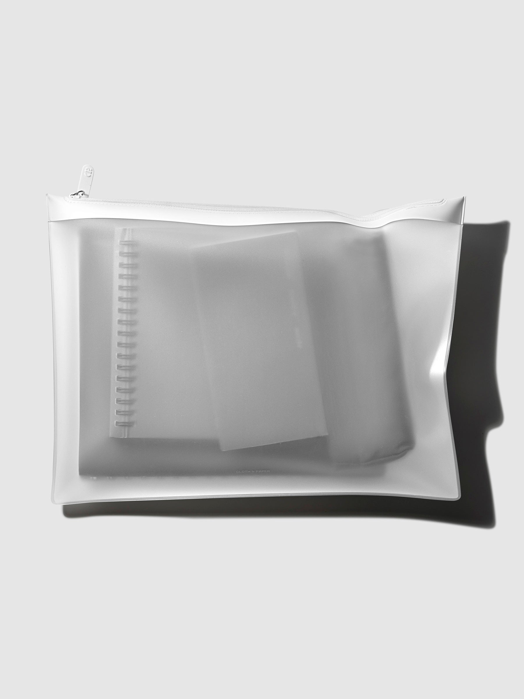 Storage Holder displayed filled with several notebooks on a neutral background.