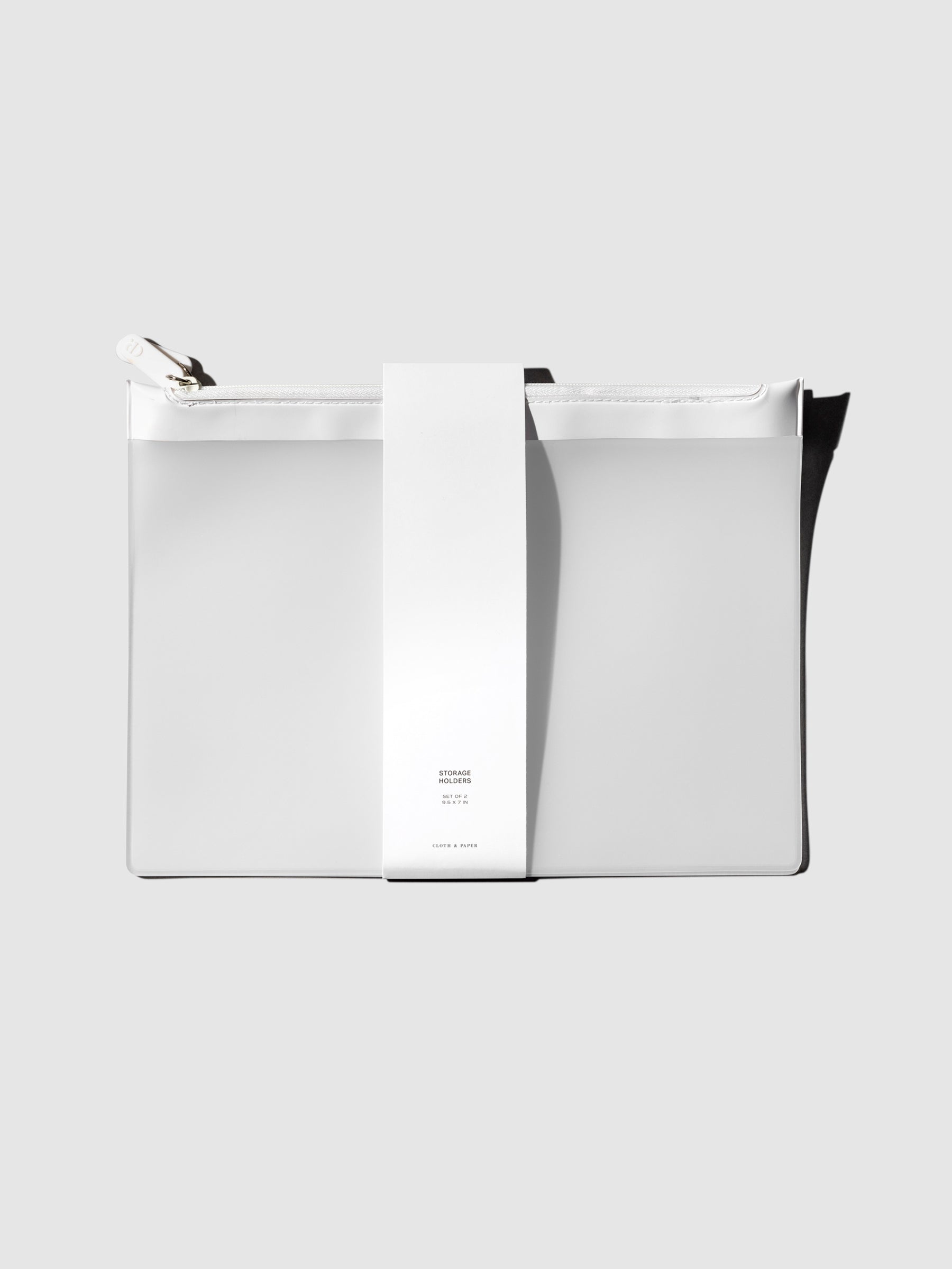 Storage Holders, Cloth and Paper. Bag shown with its belly band packaging on a neutral background.