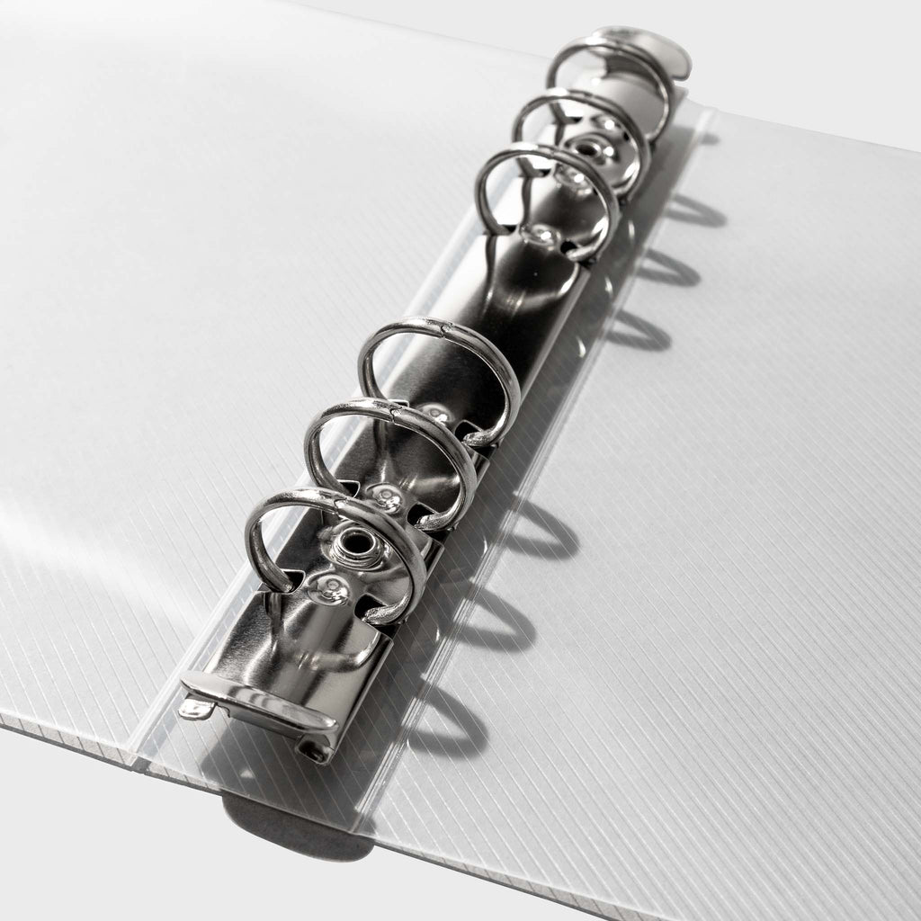 Close up image of the clear binder's silver rings.