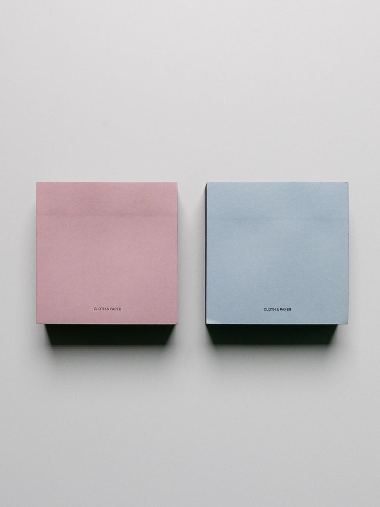 Colorblock Sticky Note Set in pink/red and blue/navy shown side by side.